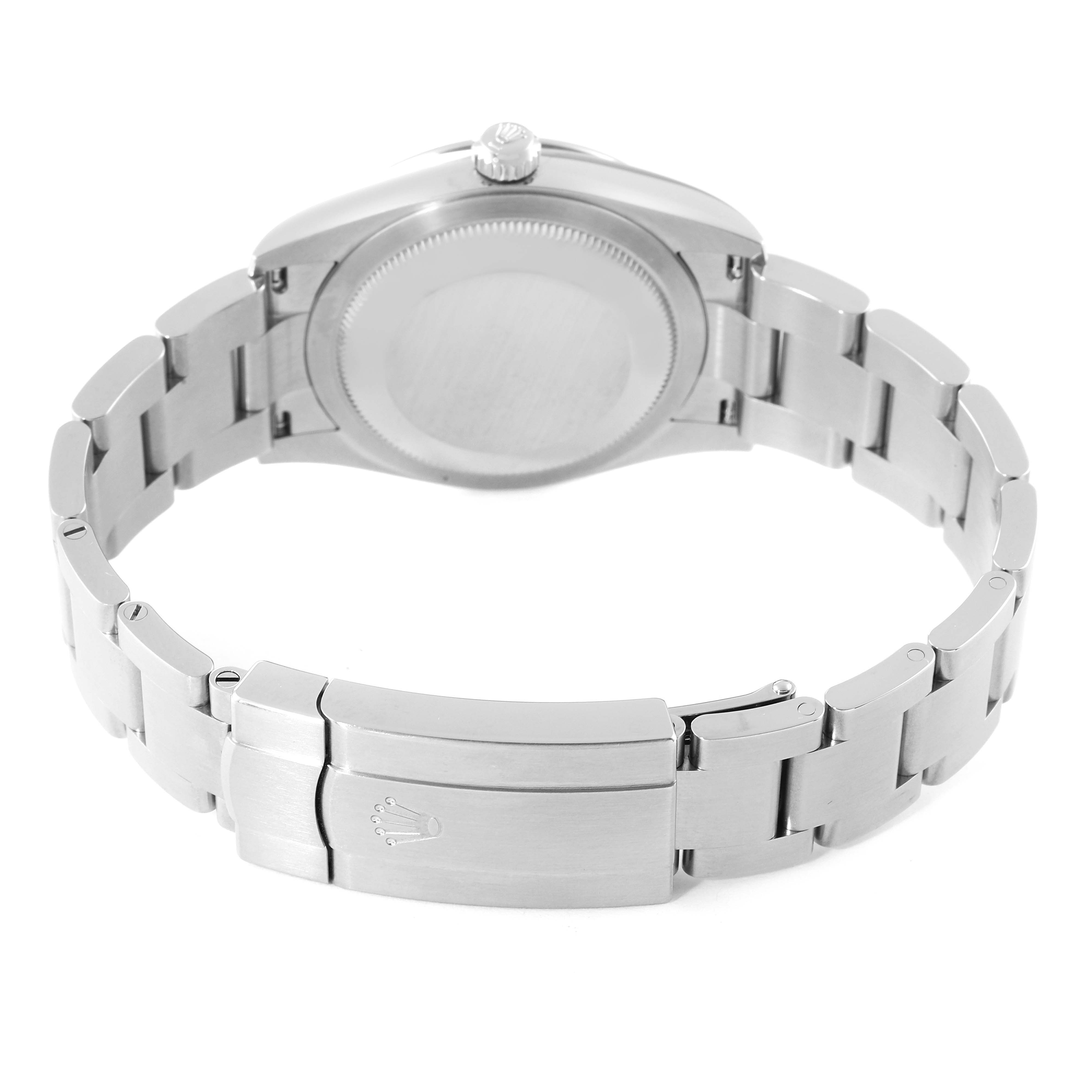 The image shows the backside and clasp of the Rolex Oyster Perpetual 124200 Men's Stainless Steel Blue Dial 124200 Men's Stainless Steel Blue Dial watch, highlighting its stainless steel bracelet and engraving.