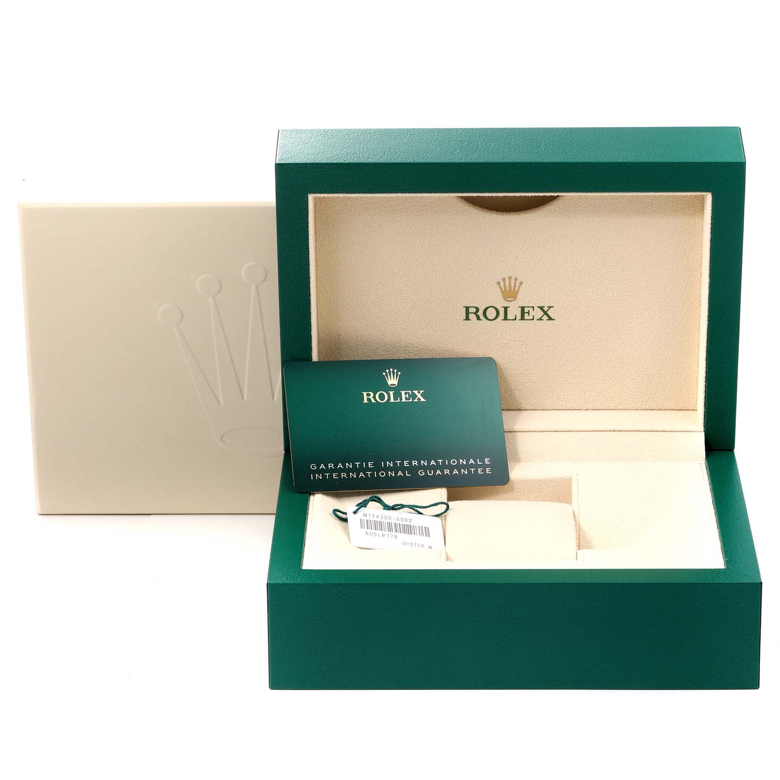 The image shows an empty Rolex Oyster Perpetual 124300 Men
s Stainless Steel Black Dial 124300 Men
s Stainless Steel Black Dial watch box with an international guarantee card and a tag inside.