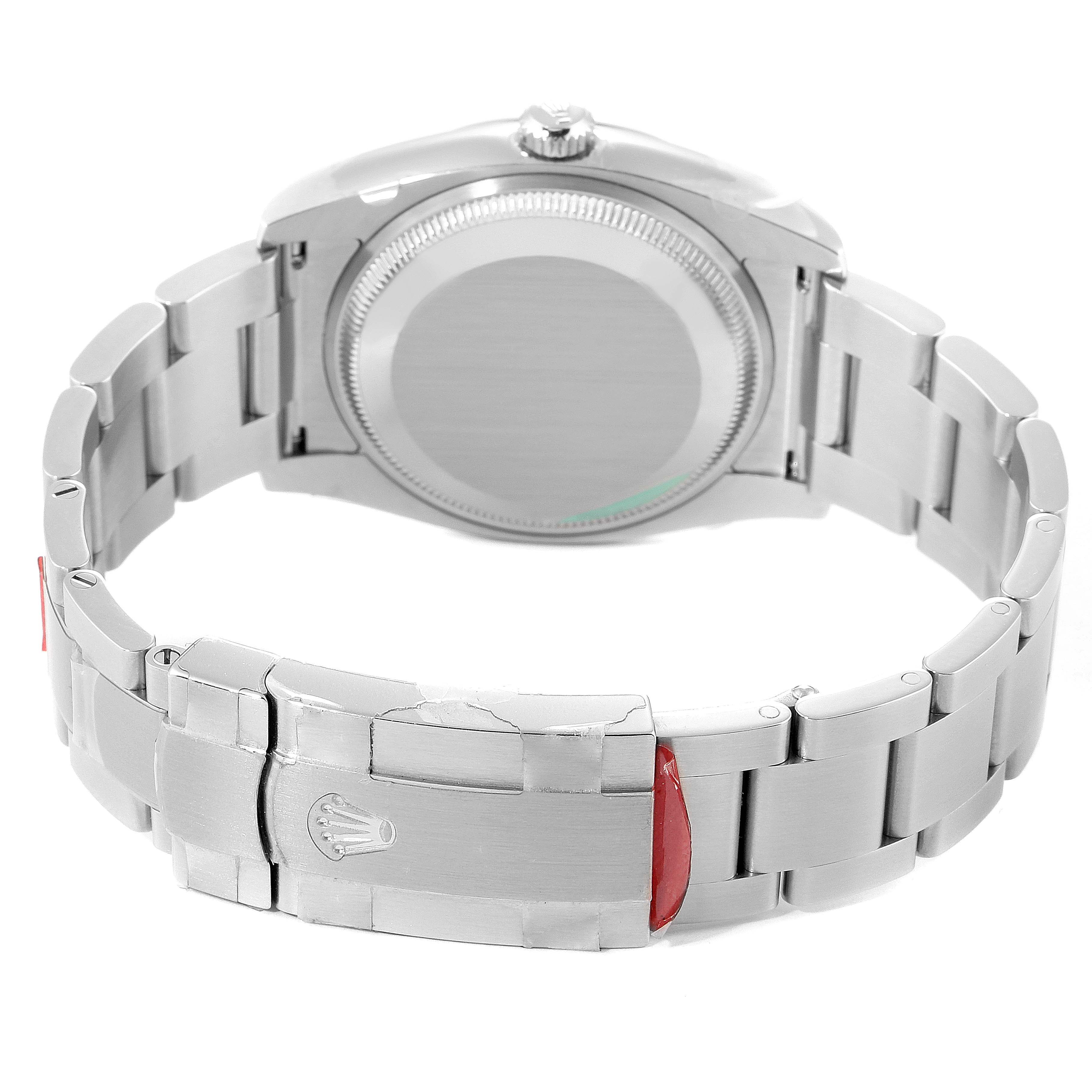 The image shows the back case and bracelet clasp of a Rolex Oyster Perpetual 114200 Men's Stainless Steel Silver Dial 114200 Men's Stainless Steel Silver Dial watch, viewed from the rear.