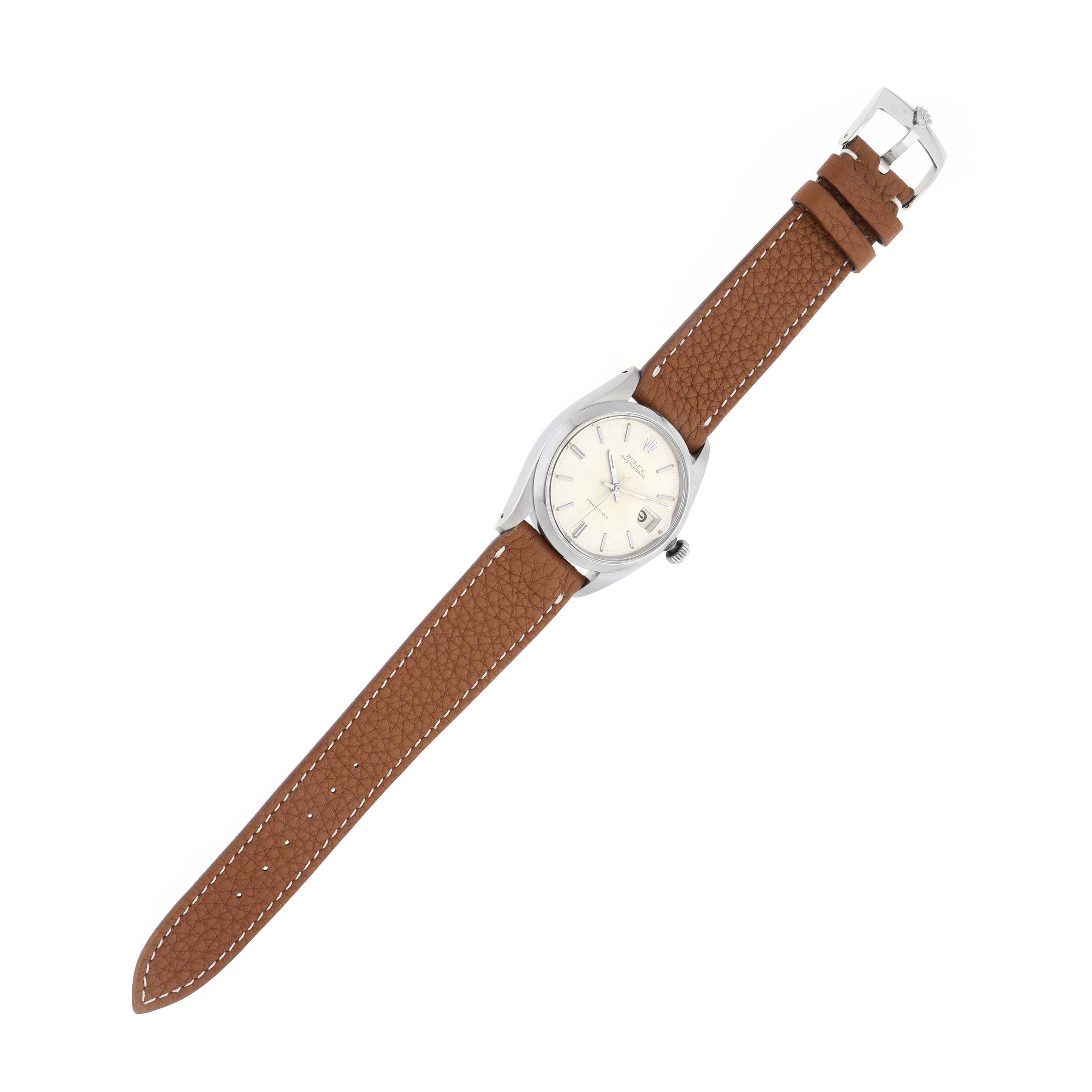 The Rolex Vintage Collection 6694 Men
s Stainless Steel Silver Dial watch is shown from a top-down angle, displaying its face, brown leather strap, and buckle.