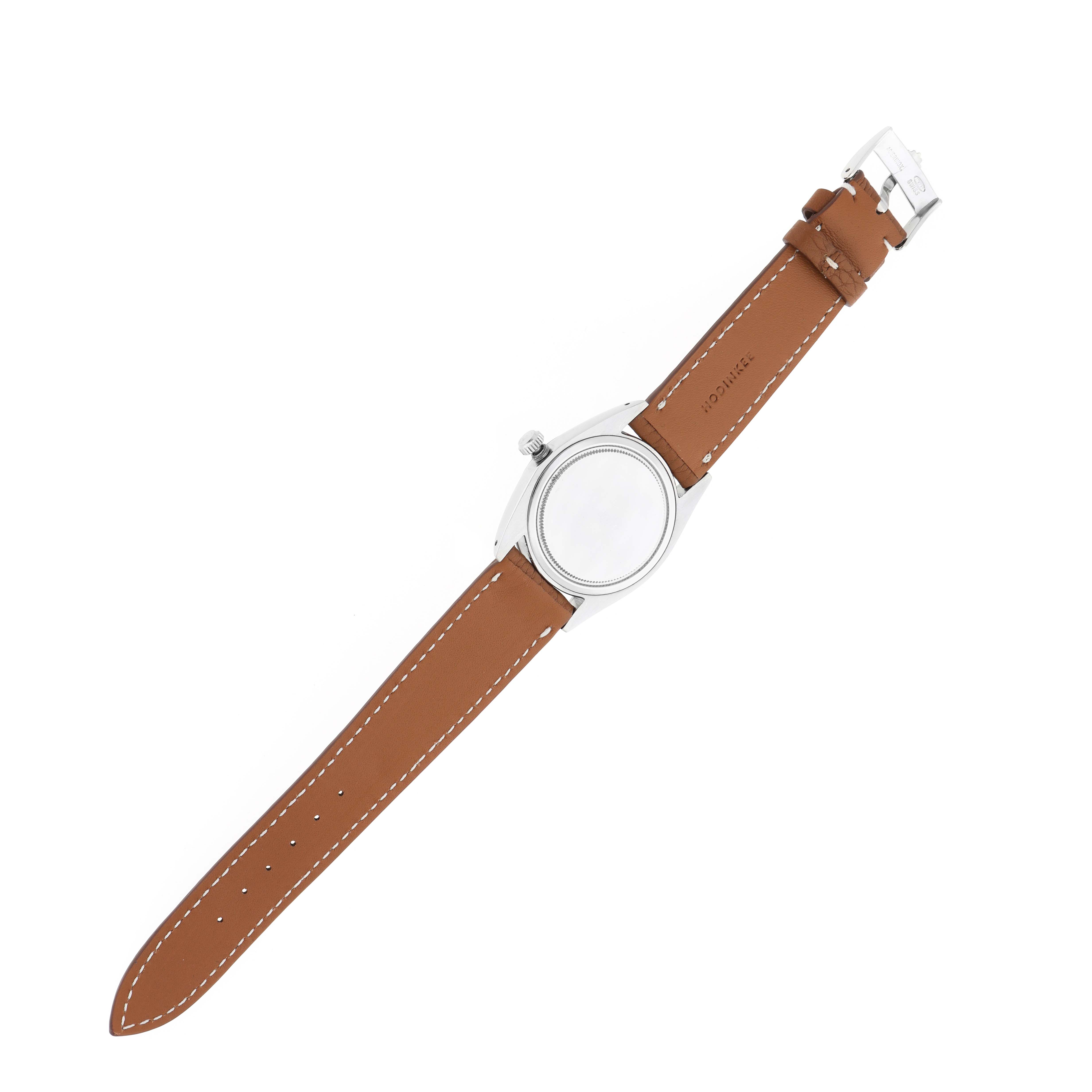 The Rolex Vintage Collection 6694 Men
s Stainless Steel Silver Dial watch is shown from the back, displaying its leather strap and case back.