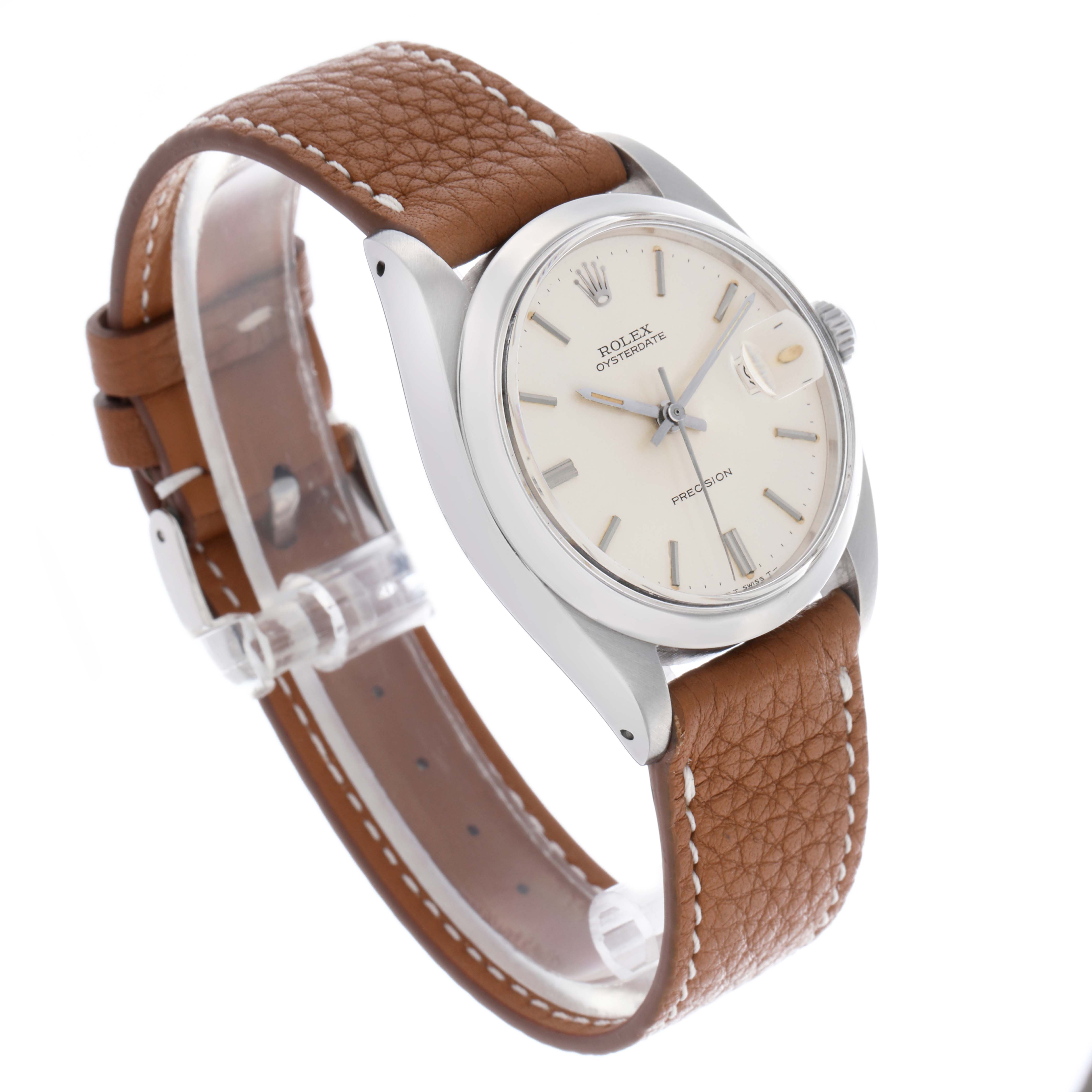 The Rolex Vintage Collection 6694 Men
s Stainless Steel Silver Dial model is shown at a three-quarter angle, highlighting the face, bezel, and brown leather strap.