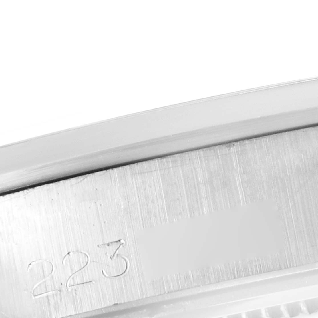 This image shows a close-up view of the engraved serial number on the case of the Rolex Vintage Collection 6426 Men's Stainless Steel Silver Dial 6426 Men's Stainless Steel Silver Dial model.