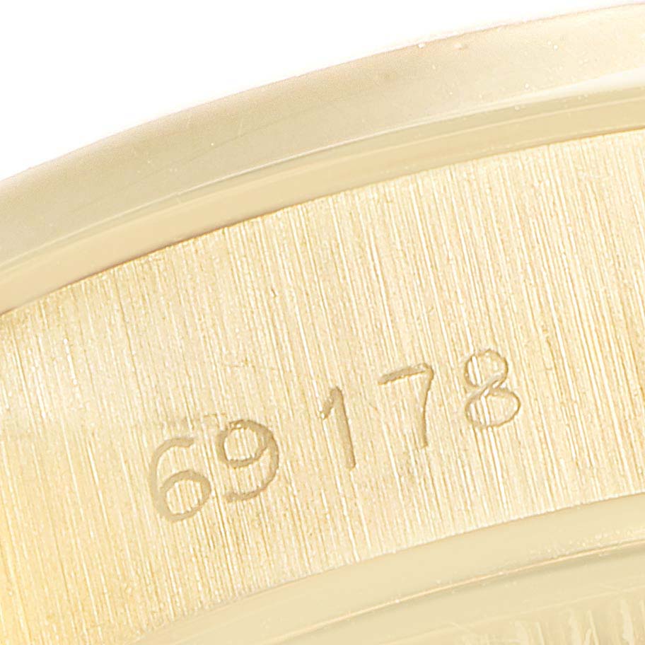 This close-up image shows the model number "69178" on the side of the Rolex President 69178 Women's Yellow Gold Silver Dial 69178 Women's Yellow Gold Silver Dial watch case.