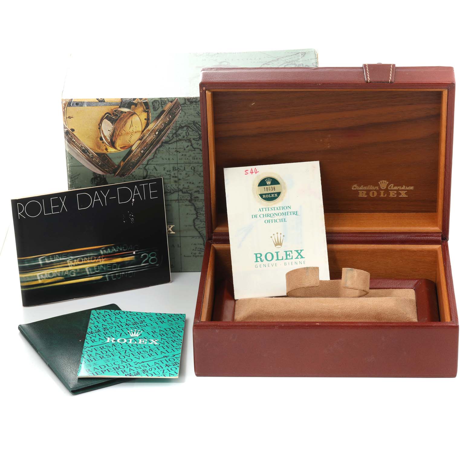 The image shows the packaging, manuals, and certificate for a Rolex President 18038 Men
s Yellow Gold Champagne Dial 18038 Men
s Yellow Gold Champagne Dial model watch, including a watch box and papers.