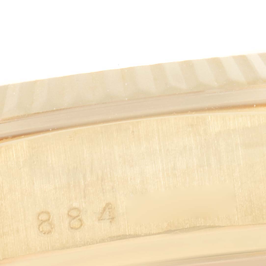 This is a close-up of the bezel and part of the band number of a Rolex President 18038 Men's Yellow Gold Champagne Dial 18038 Men's Yellow Gold Champagne Dial model watch.