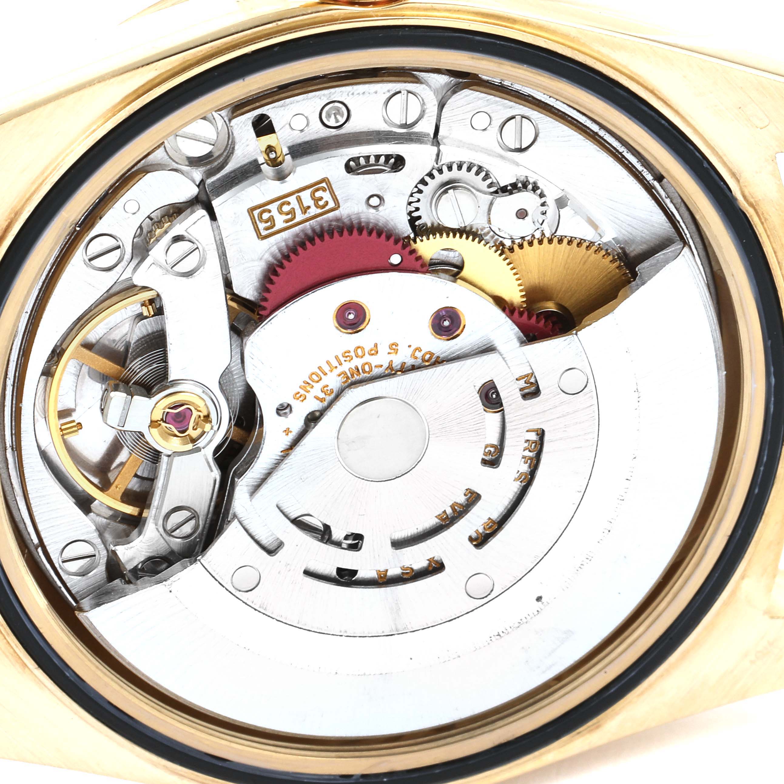 This image shows a close-up of the intricate inner mechanism of a Rolex President 18238 Men's Yellow Gold Champagne Dial 18238 Men's Yellow Gold Champagne Dial model's movement.