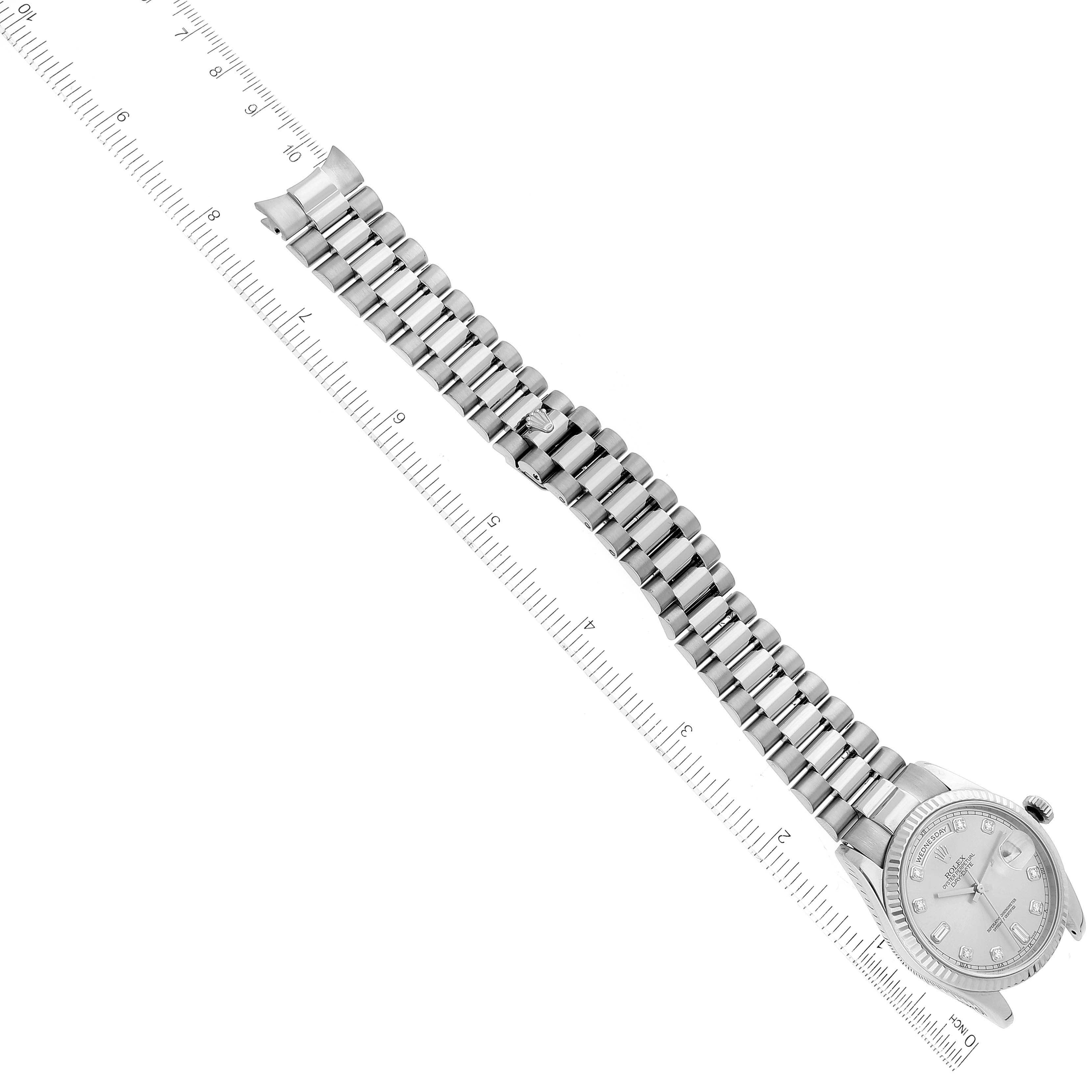 The image shows the Rolex President 118239 Men's White Gold Silver Dial 118239 Men's White Gold Silver Dial model watch from a top-down view, featuring the face and the bracelet along with a ruler for scale.