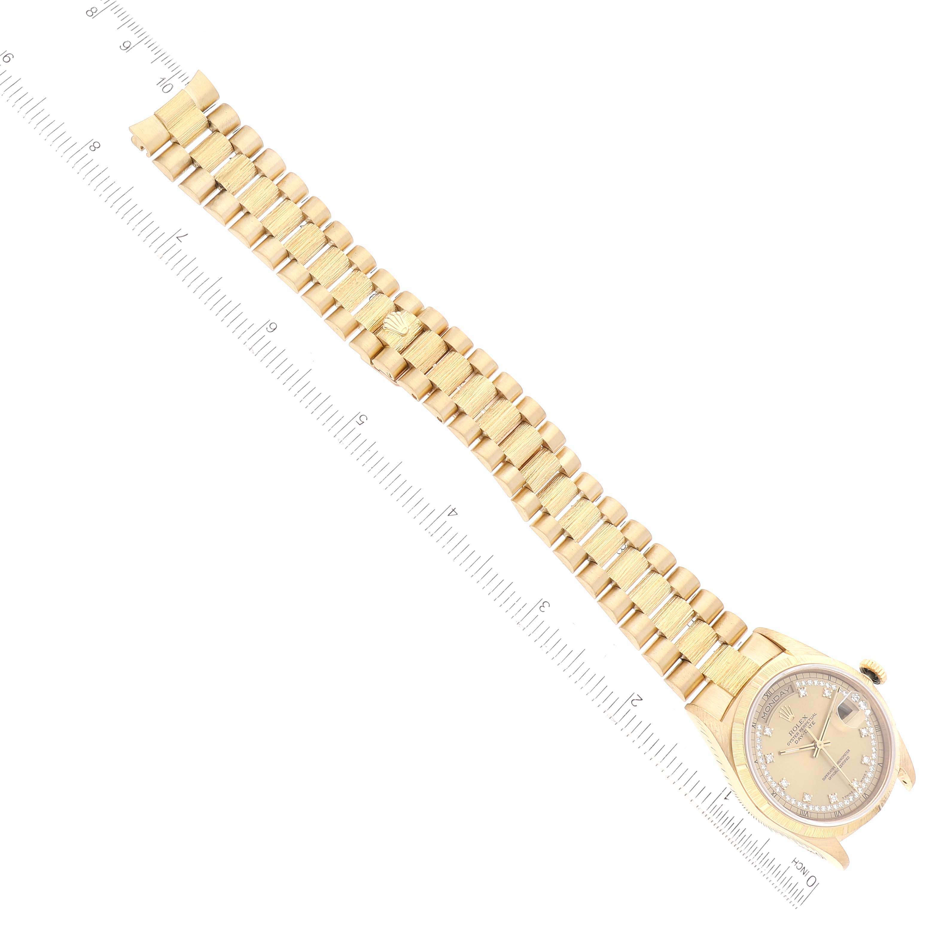 The image shows an overhead view of a Rolex President 18248 Men's Yellow Gold Champagne Dial 18248 Men's Yellow Gold Champagne Dial model watch with a gold bracelet and a ruler beside it for scale.