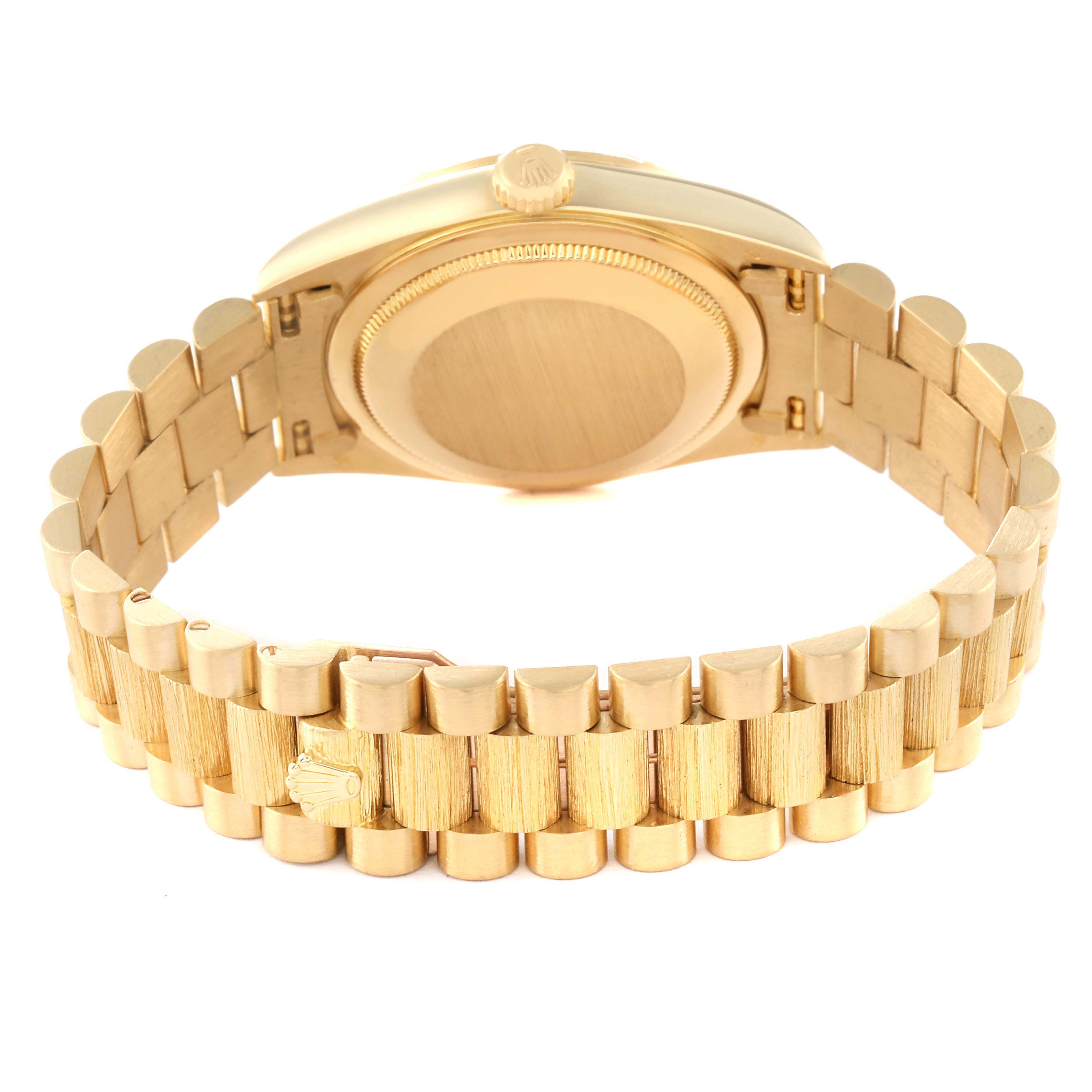 This image shows the underside and back case of a Rolex President 18248 Men's Yellow Gold Champagne Dial 18248 Men's Yellow Gold Champagne Dial model wristwatch, highlighting the gold bracelet and clasp.