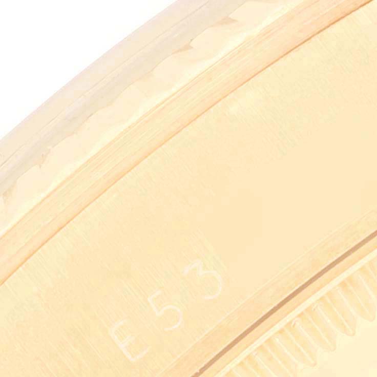 The image shows a close-up of the side of a Rolex President 68278 Women's Yellow Gold Champagne Dial 68278 Women's Yellow Gold Champagne Dial watch case, with visible engravings and texture details.