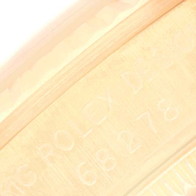 This image shows a close-up of the inner case back of a President model Rolex watch, displaying engravings.