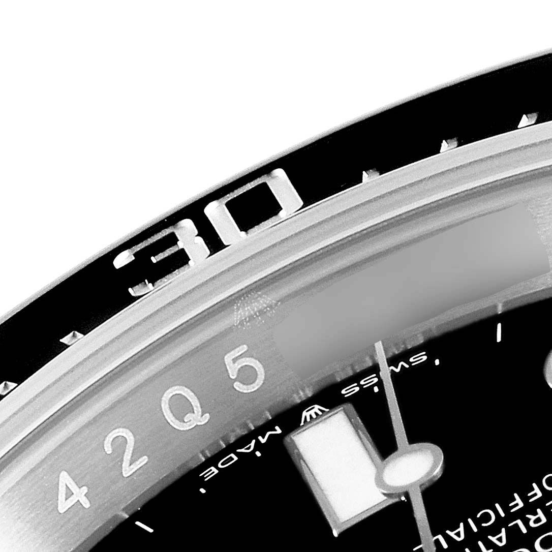 The image shows a close-up of the bezel, dial, and part of the minute hand of a Rolex Sea-Dweller 126600 Men's Stainless Steel Black Dial 126600 Men's Stainless Steel Black Dial watch.