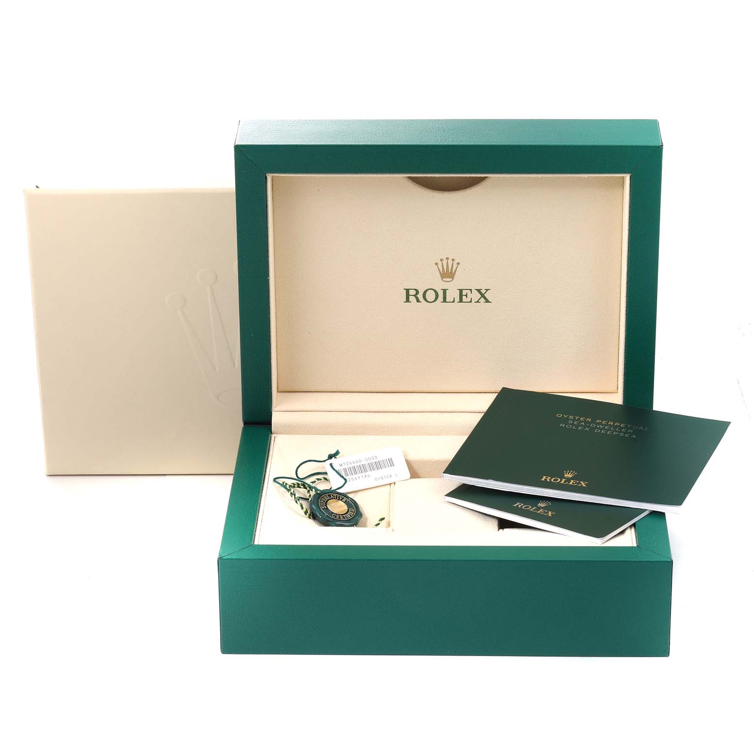 This image shows the open box and manual of a Rolex Sea-Dweller 126660 Men's Stainless Steel Blue Dial 126660 Men's Stainless Steel Blue Dial watch.