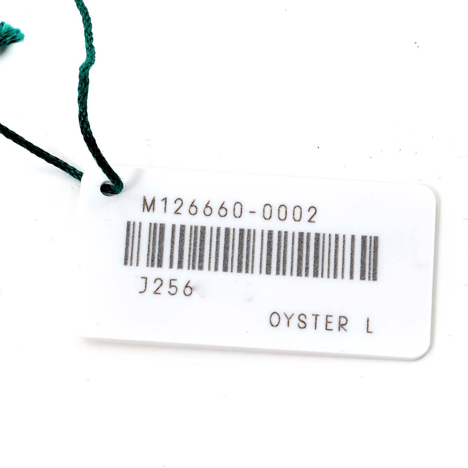 This image shows a tag with the model number M126660-0002 for a Rolex Sea-Dweller 126660 Men's Stainless Steel Blue Dial 126660 Men's Stainless Steel Blue Dial watch.