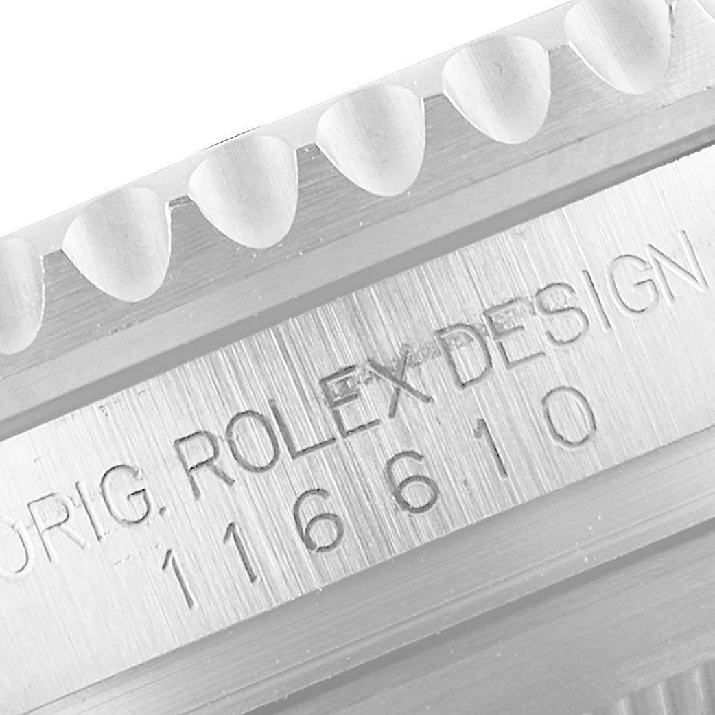 This close-up image shows the engraved bezel markings and part of the model number of a Rolex Submariner 116610 Men's Stainless Steel Black Dial 116610 Men's Stainless Steel Black Dial watch.