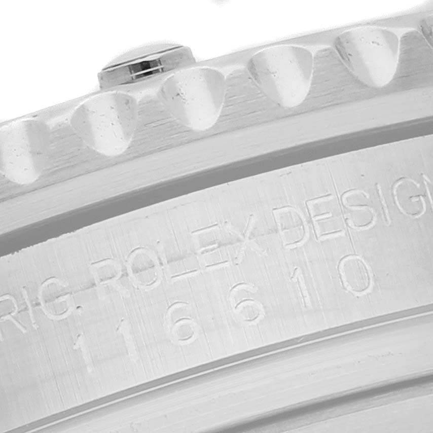 The image shows a close-up of the model number and part of the bezel on a Rolex Submariner 116610 Men
s Stainless Steel Black Dial 116610 Men
s Stainless Steel Black Dial watch.