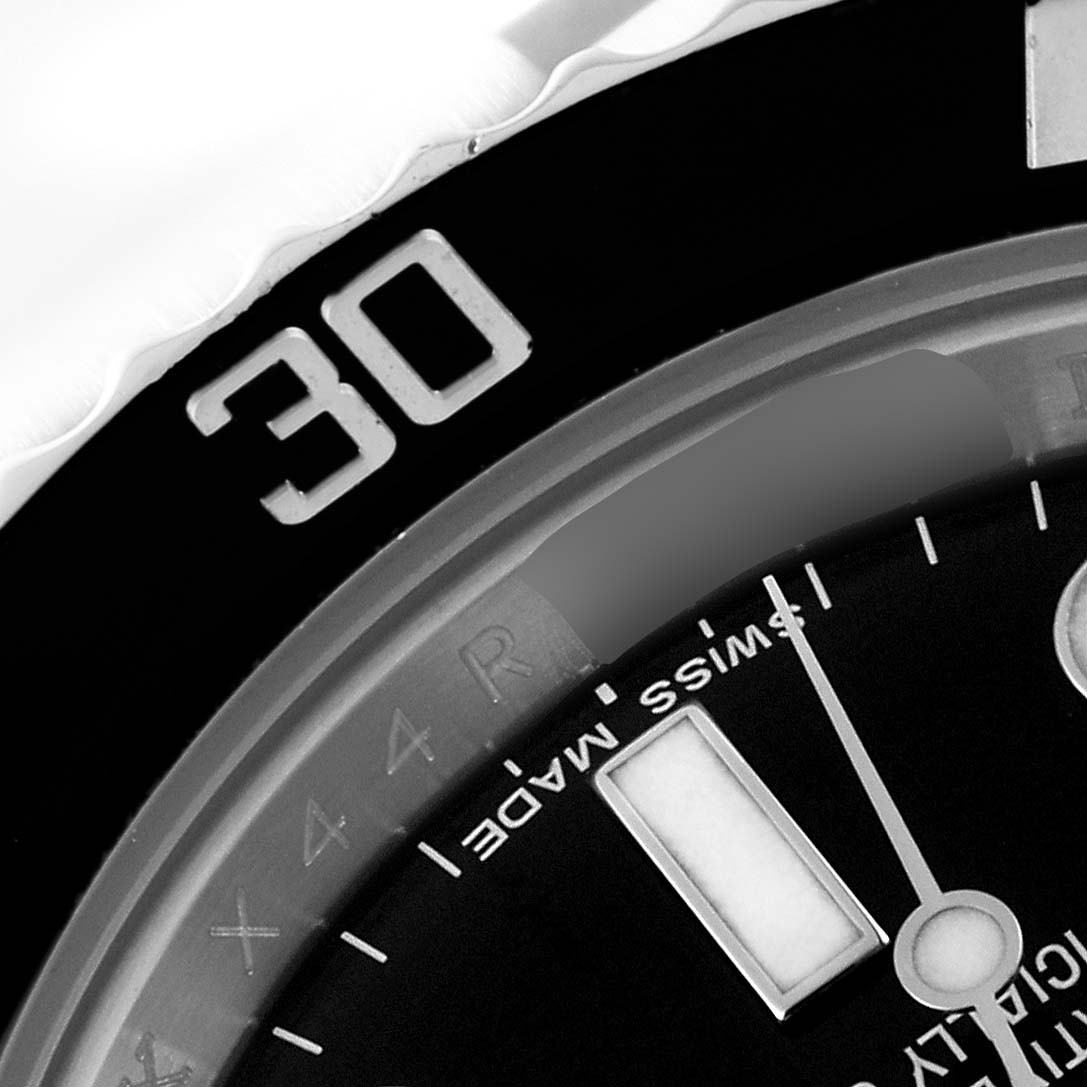 The image shows a close-up of the 30-minute mark on the bezel and part of the dial on a Rolex Submariner 116610 Men
s Stainless Steel Black Dial 116610 Men
s Stainless Steel Black Dial watch.