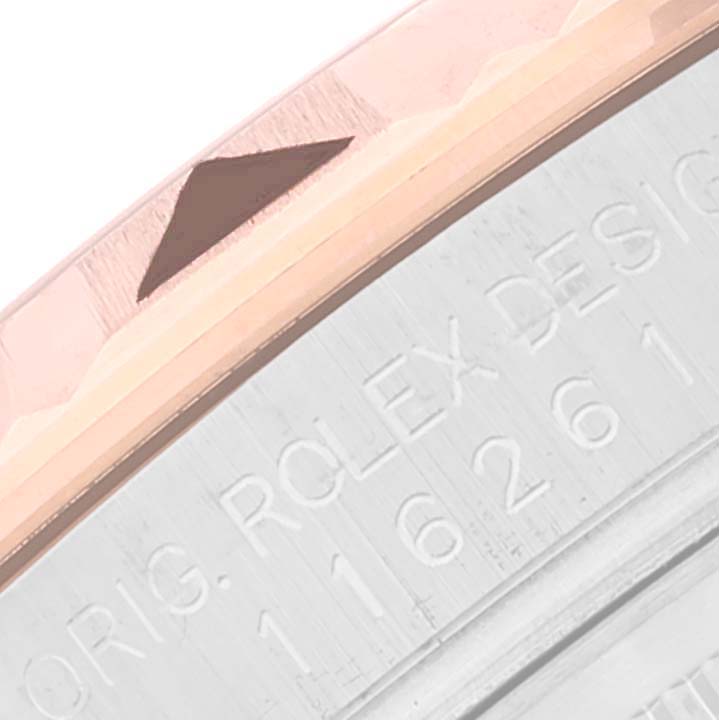 The image shows a close-up of the bezel and engraving on the side of a Rolex Turn-o-Graph 116261 Men's Steel and Gold (two tone) Black Dial 116261 Men's Steel and Gold (two tone) Black Dial watch.