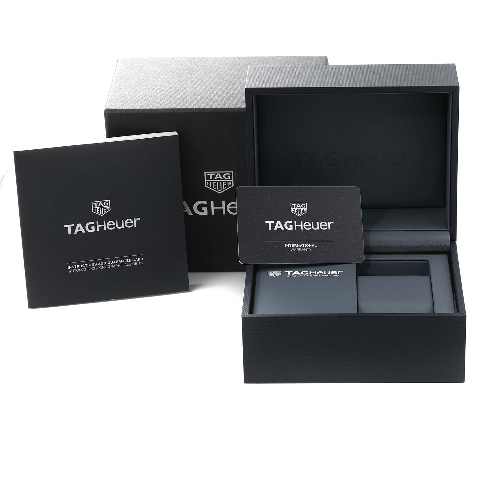 This image shows the packaging, instruction manual, and warranty card for a Tag Heuer Carrera CV2A1V.BA0738 Men's Stainless Steel Blue Dial CV2A1V.BA0738 Men's Stainless Steel Blue Dial model watch.