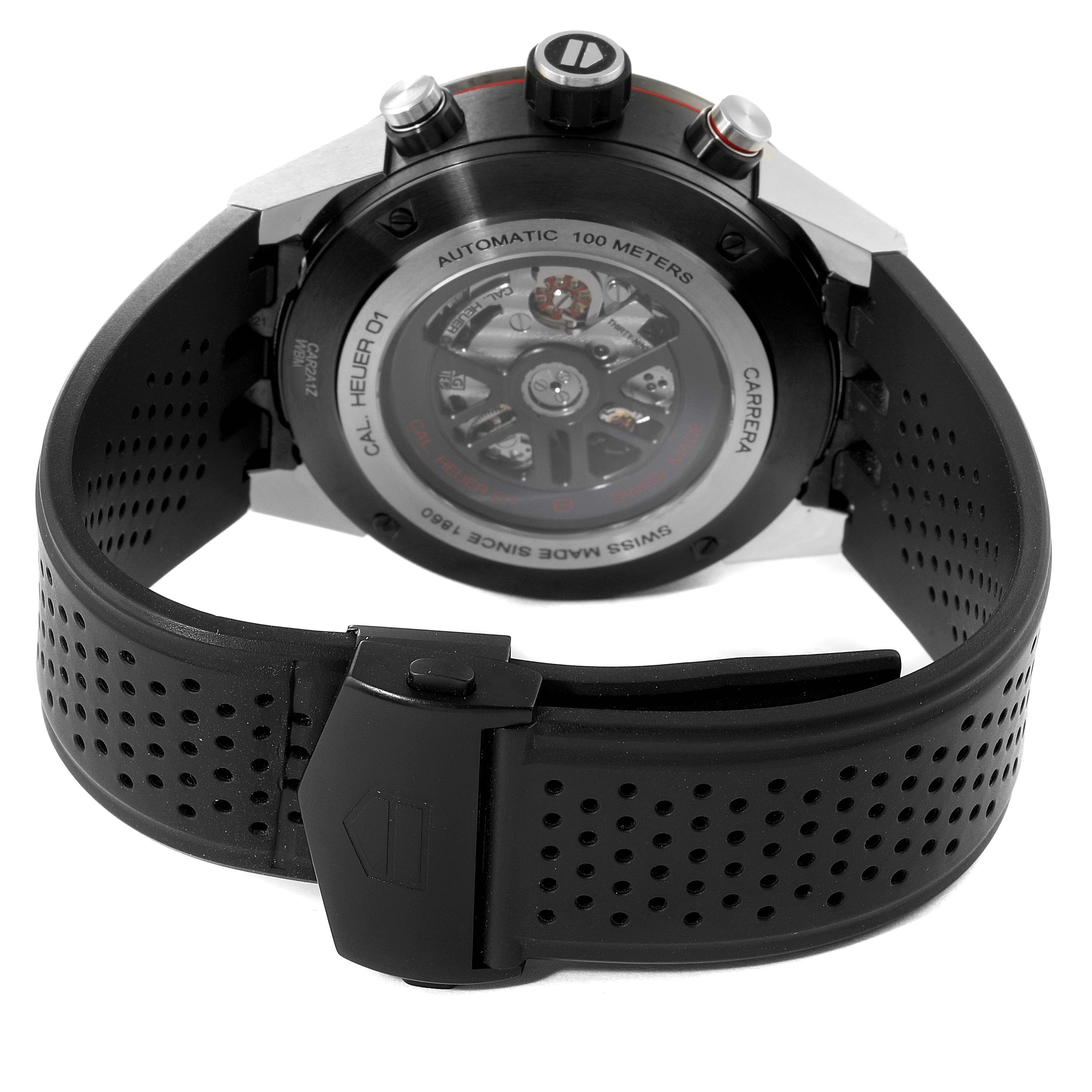The image shows the back view of a Tag Heuer Carrera CAR2A1Z.FT6044 Men's Stainless Steel Black Dial CAR2A1Z.FT6044 Men's Stainless Steel Black Dial watch, focusing on its automatic movement and perforated rubber strap.