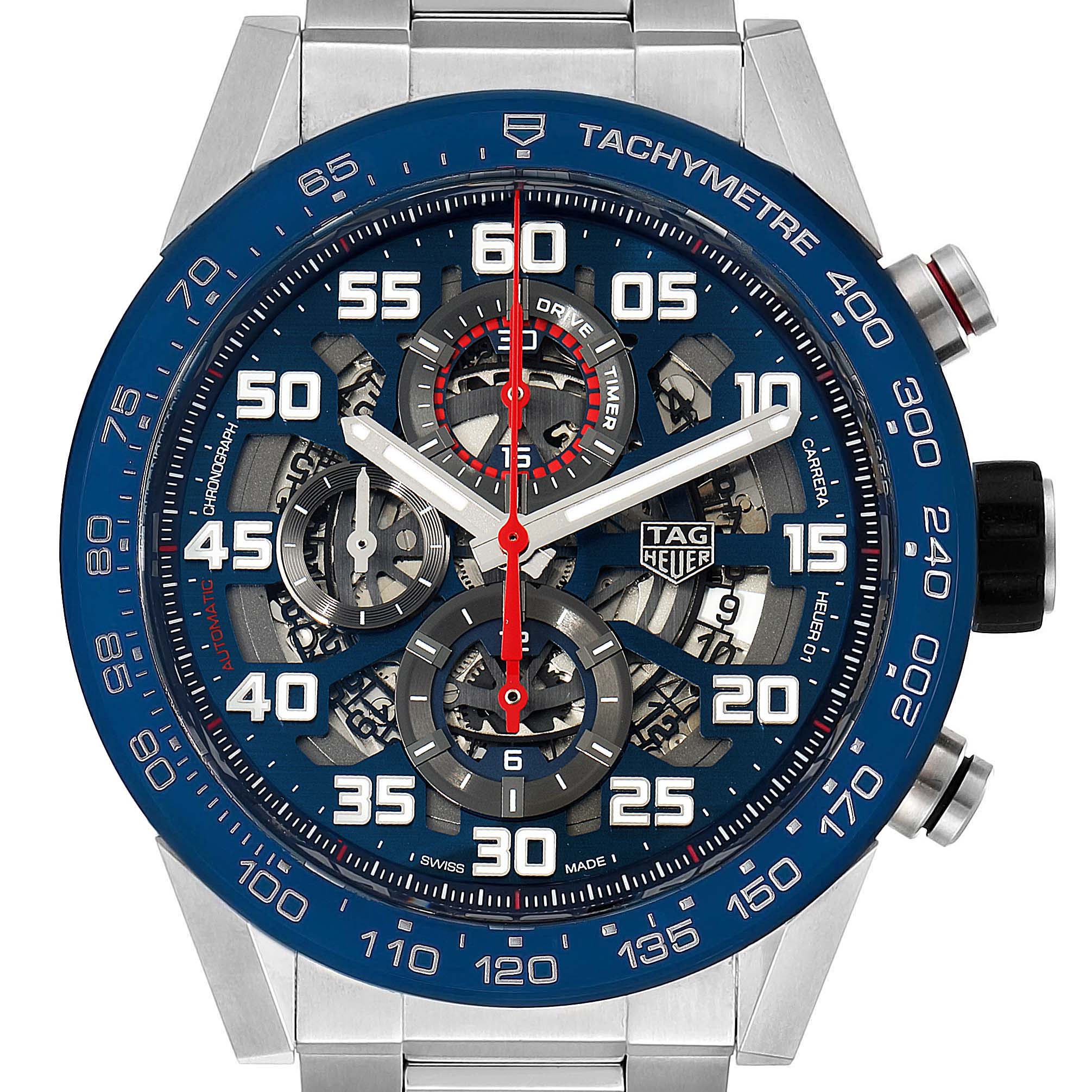 The Tag Heuer Carrera CAR2A1K.BA0703 Men's Stainless Steel Blue Dial CAR2A1K.BA0703 Men's Stainless Steel Blue Dial watch is shown from a frontal angle, displaying the dial, tachymeter bezel, and chronograph subdials.