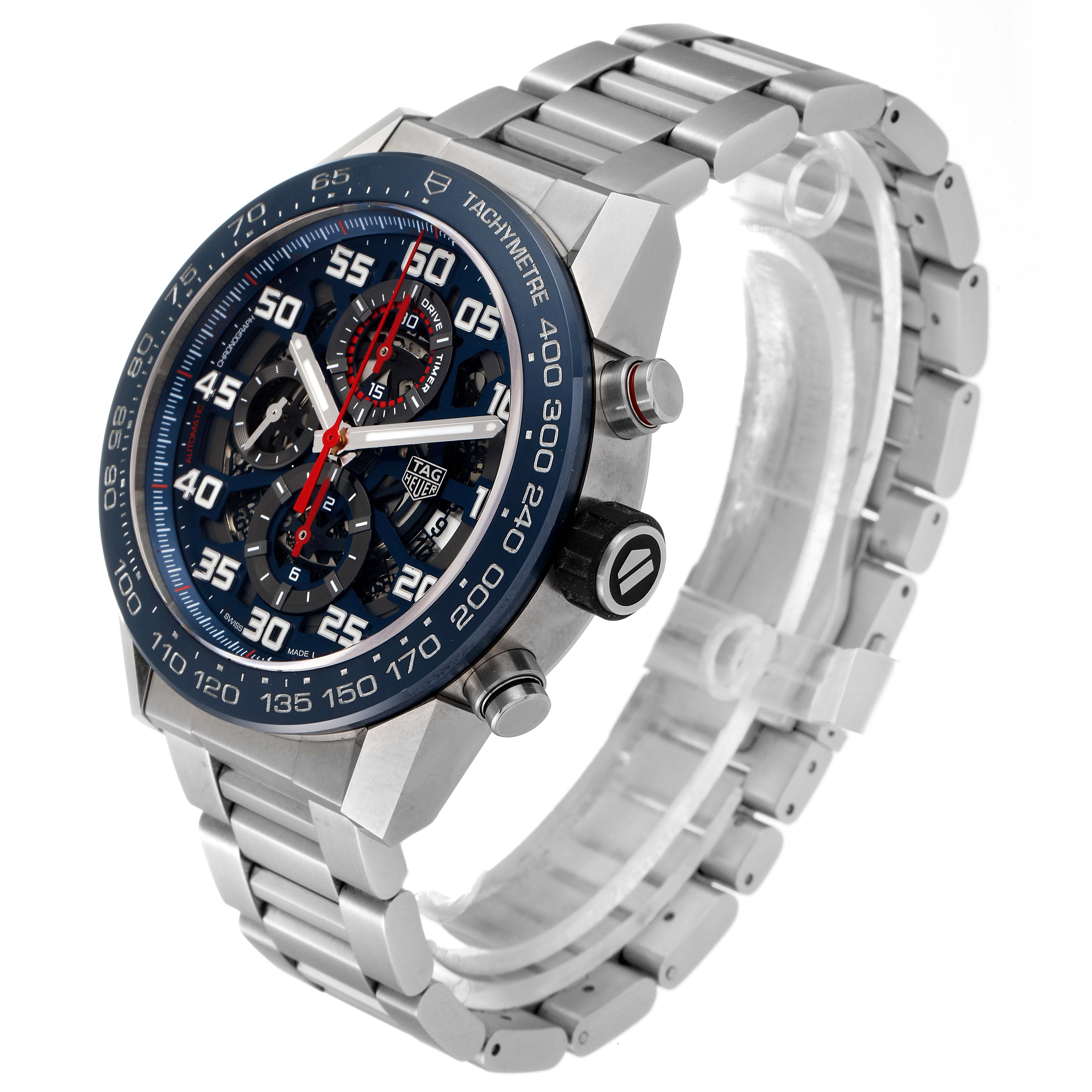 The image shows a side-angle view of the Carrera model by Tag Heuer, displaying the dial, bezel, crown, and metal strap.