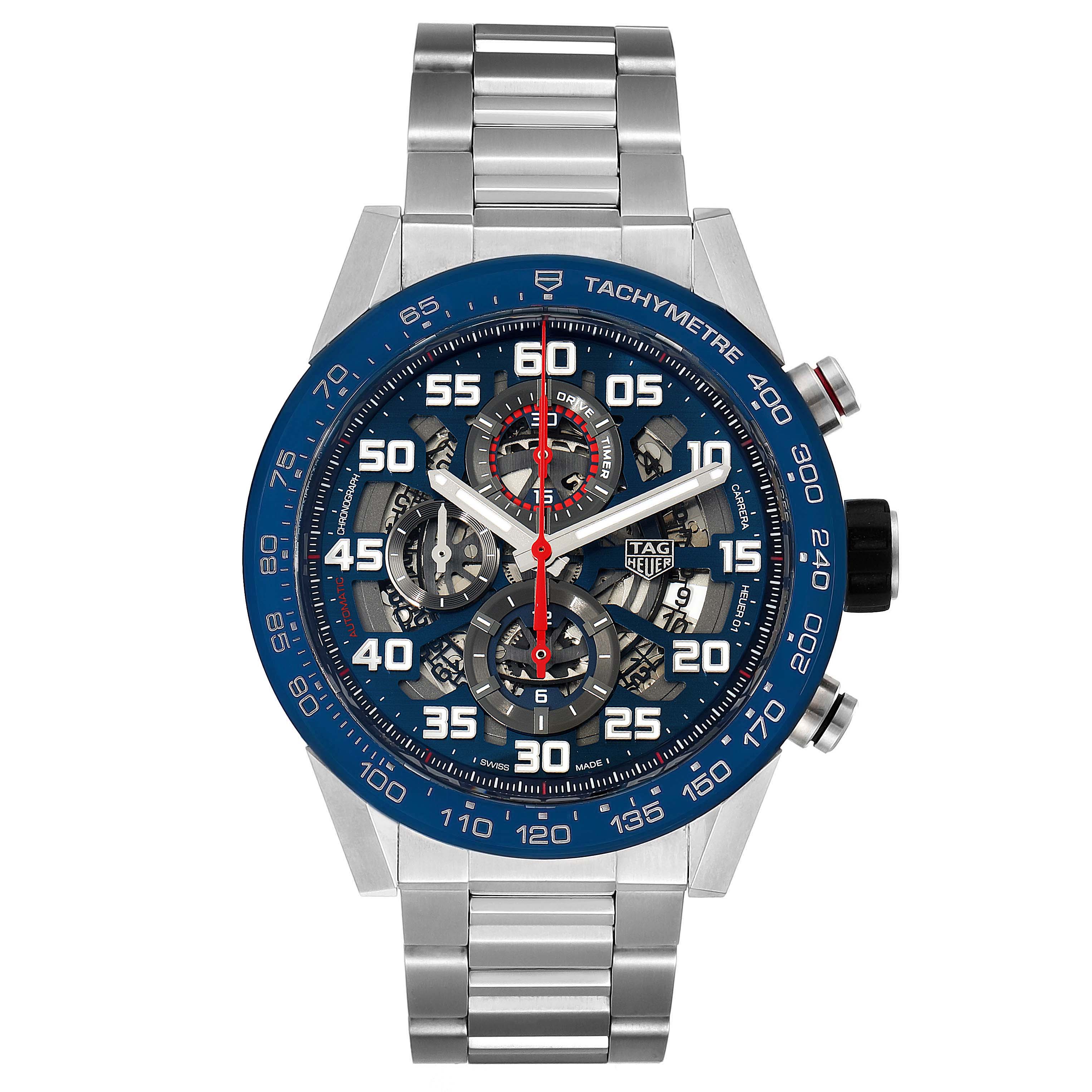 The image shows a front view of a Tag Heuer Carrera CAR2A1K.BA0703 Men's Stainless Steel Blue Dial CAR2A1K.BA0703 Men's Stainless Steel Blue Dial watch with a blue tachymeter bezel and metal bracelet.