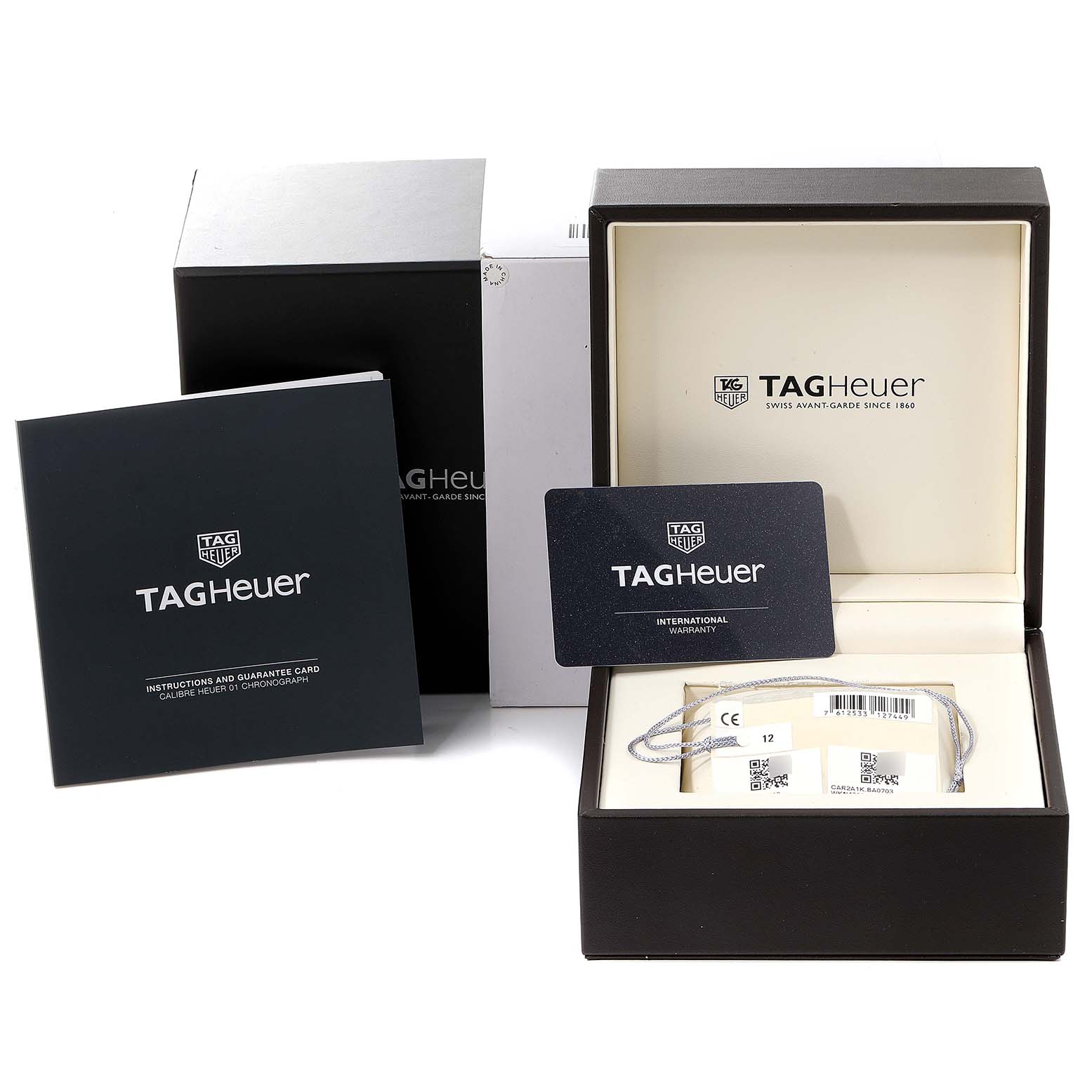 The image shows the packaging, instruction manual, and international warranty card for the Tag Heuer Carrera CAR2A1K.BA0703 Men's Stainless Steel Blue Dial CAR2A1K.BA0703 Men's Stainless Steel Blue Dial watch.