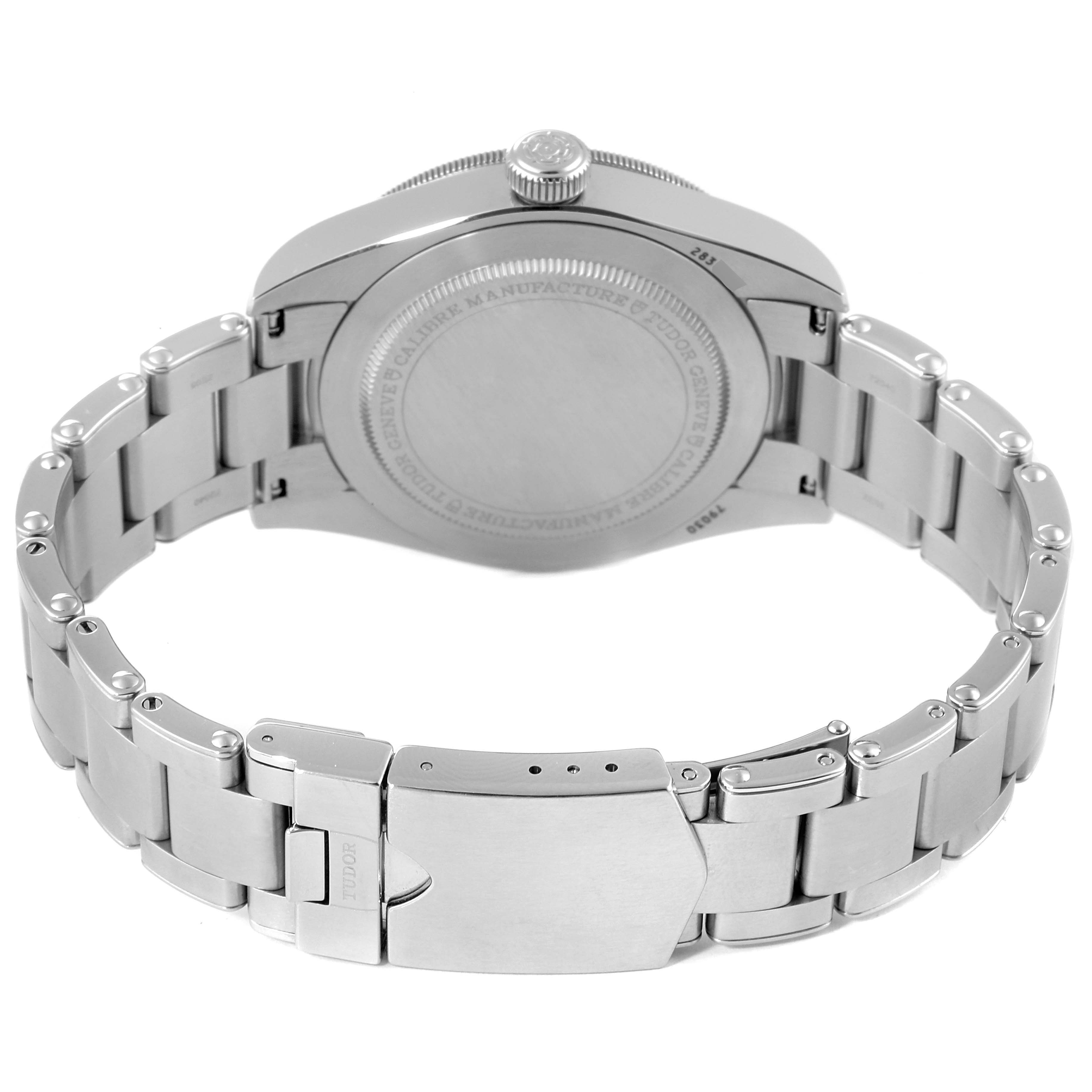 This Heritage Black Bay by Tudor is shown from the back, focusing on the case back and metal bracelet with clasp.