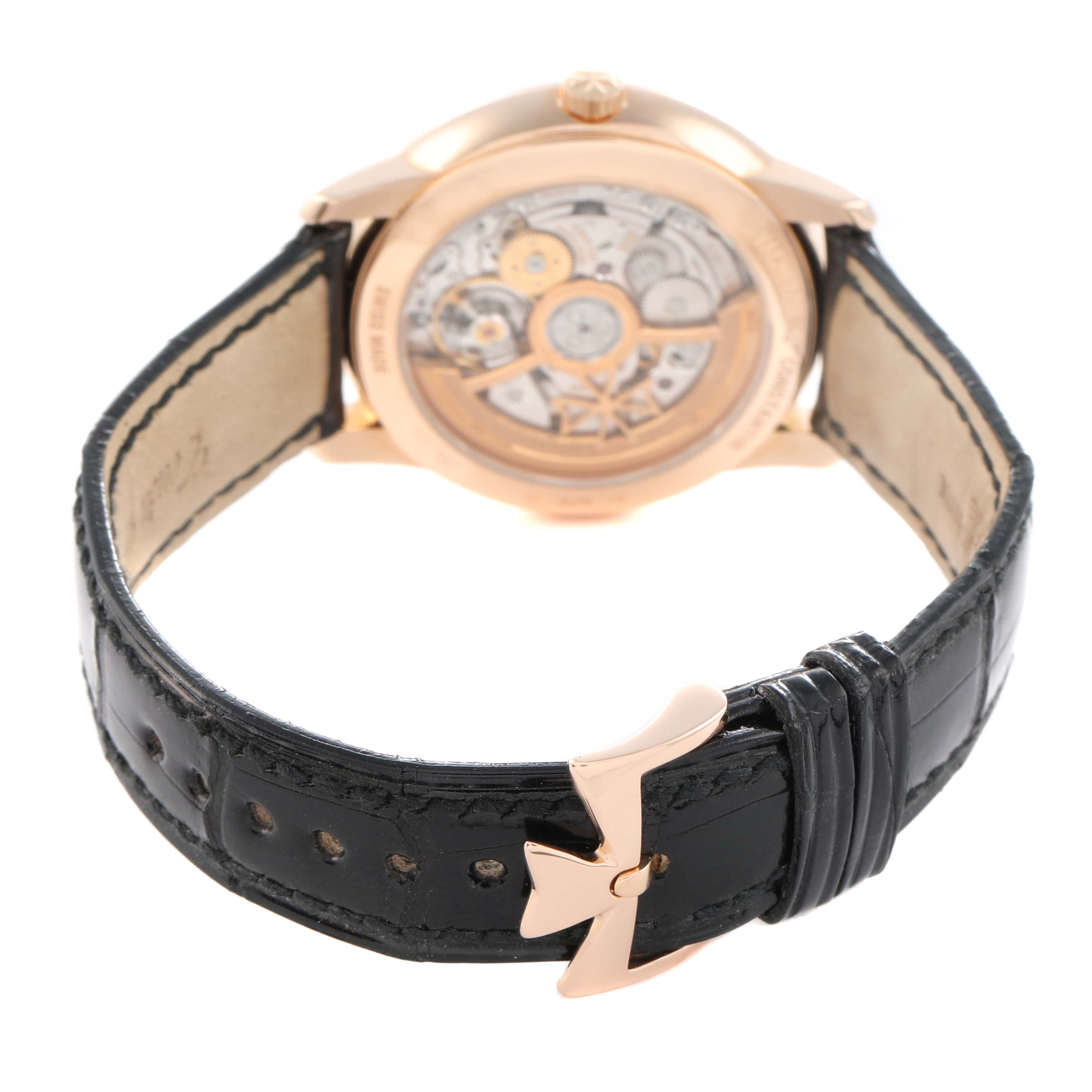 The image shows the back view of the Vacheron Constantin Patrimony 4100U Men
s Rose Gold Silver Dial, highlighting the movement and leather strap buckle.