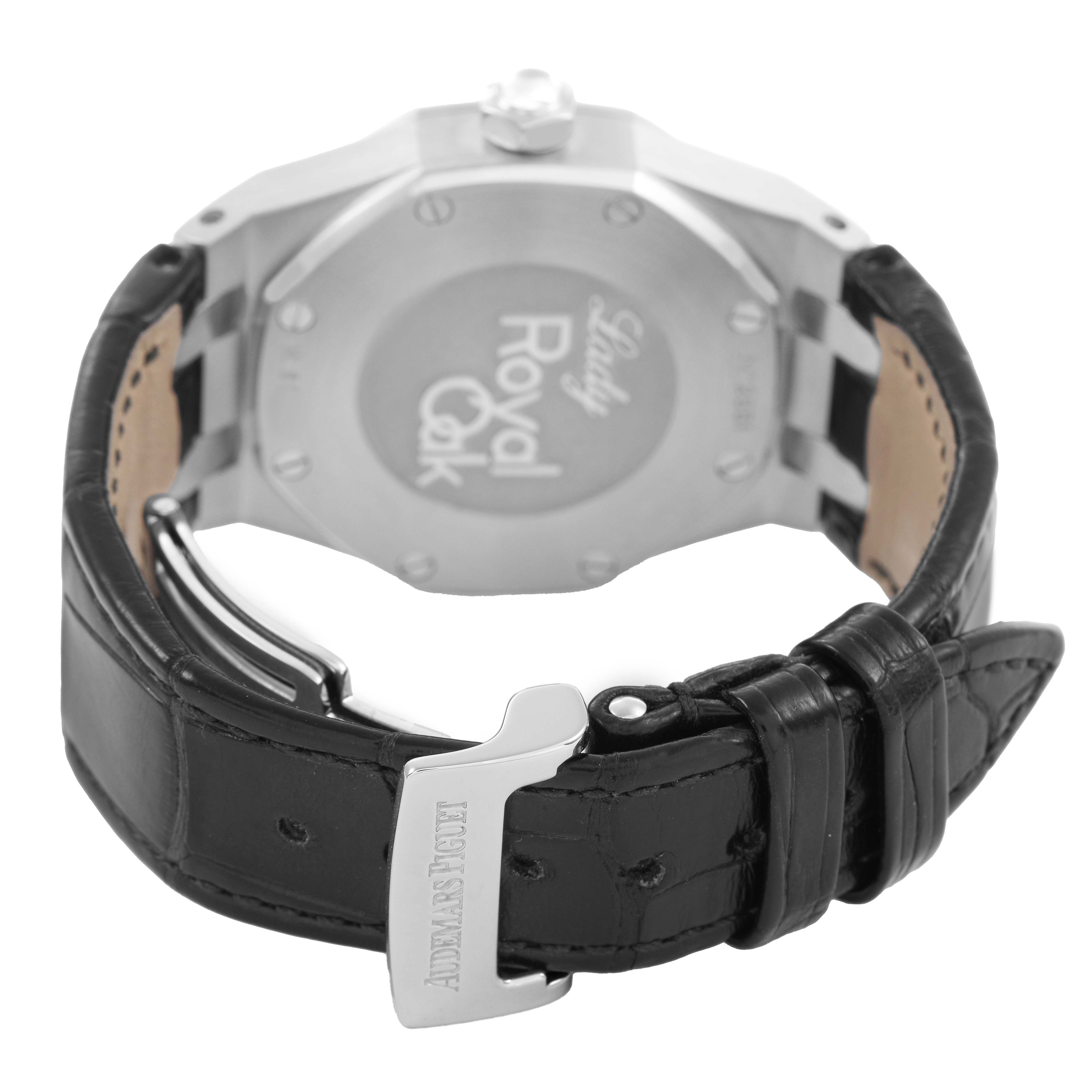 The image shows the back of an Audemars Piguet Royal Oak 77321ST.ZZ.D002CR.01 Women's Stainless Steel Black Dial watch, highlighting its caseback and black leather strap with clasp.