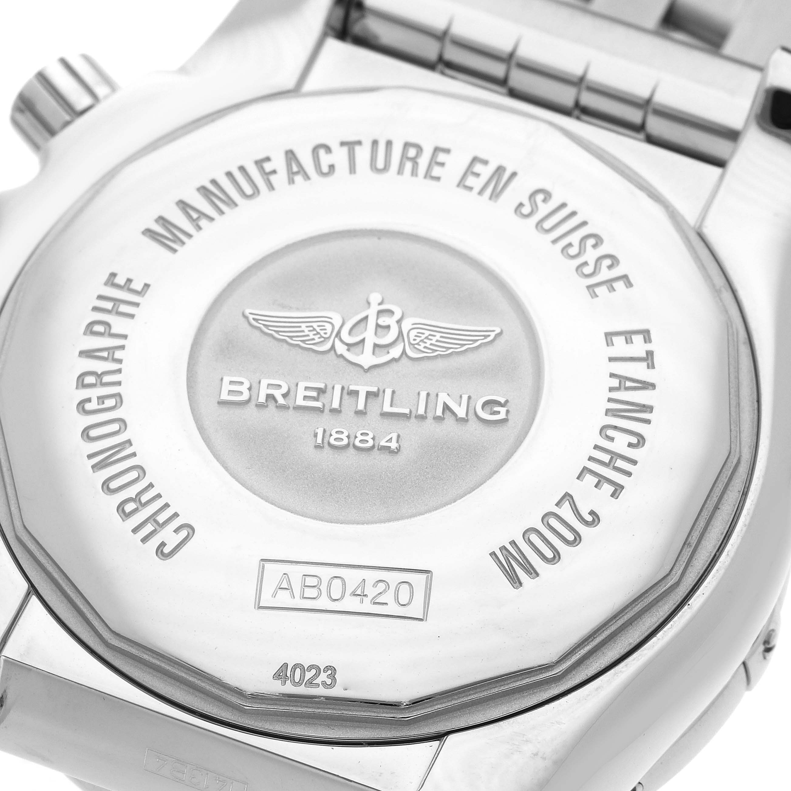 The image shows the back case of a Breitling Chronomat AB042011 Men
s Stainless Steel Brown Dial watch, highlighting engravings and branding.