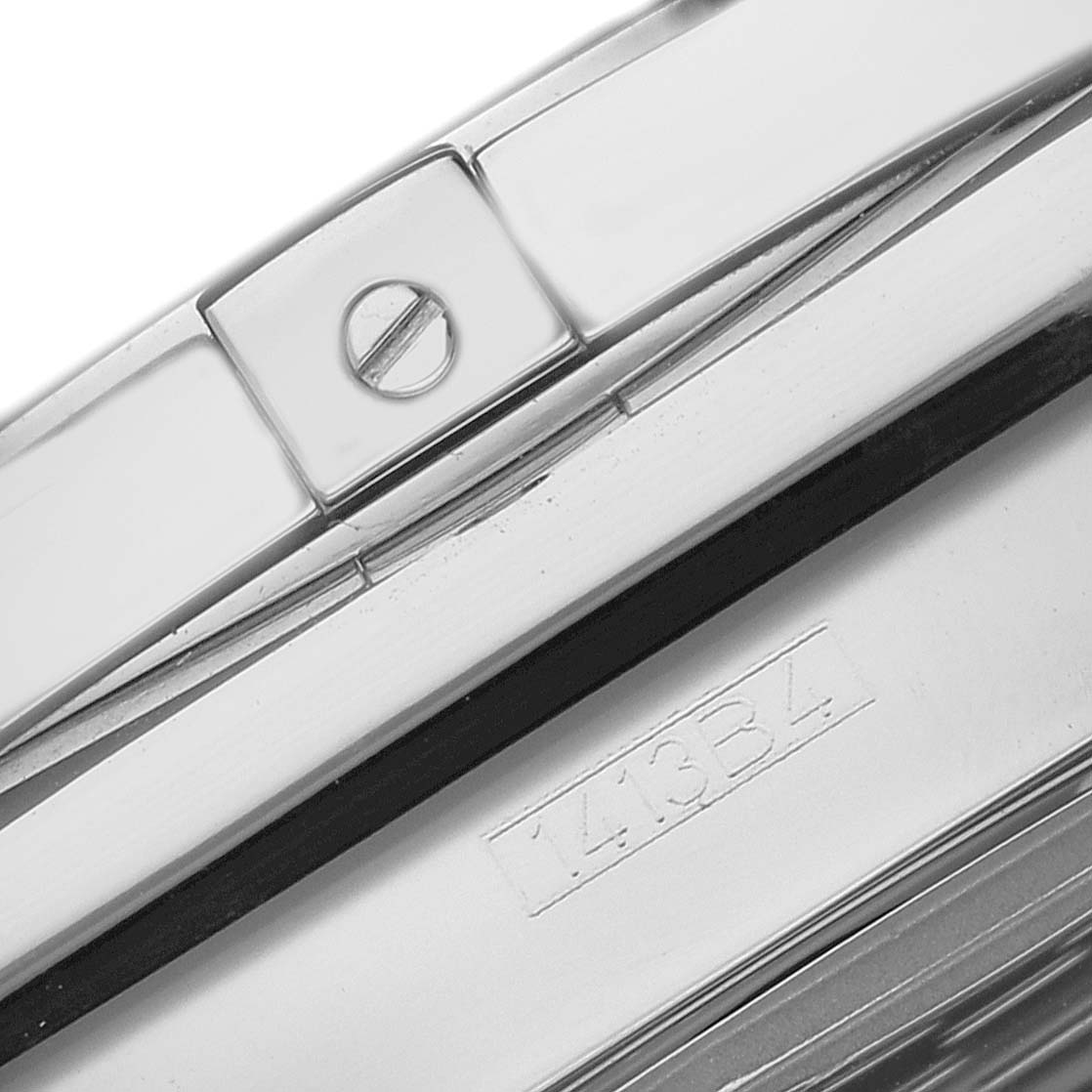 The image shows a close-up of the clasp and part of the bracelet of a Breitling Chronomat AB042011 Men
s Stainless Steel Brown Dial watch, highlighting a serial number.