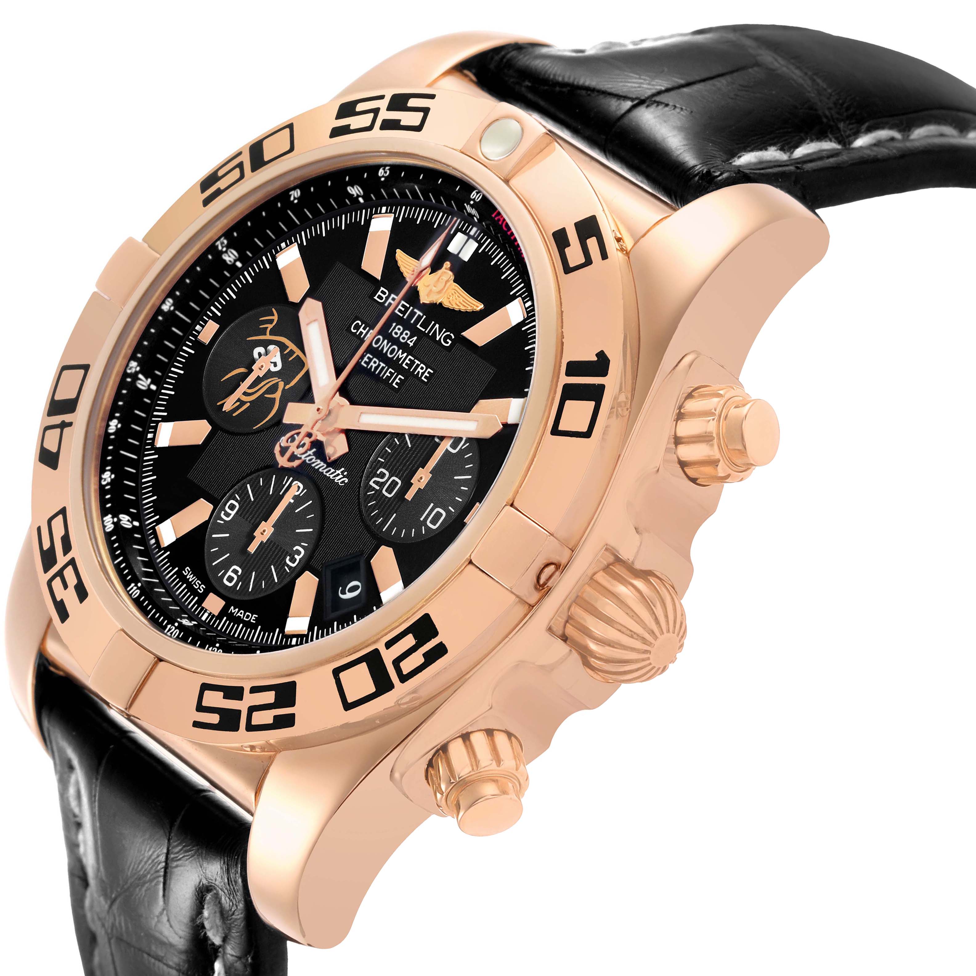 The Breitling Chronomat HB01115W/BE53 Men's Yellow Gold Black Dial watch is shown at a three-quarter angle, highlighting its rose gold case, bezel, crown, and pushers.