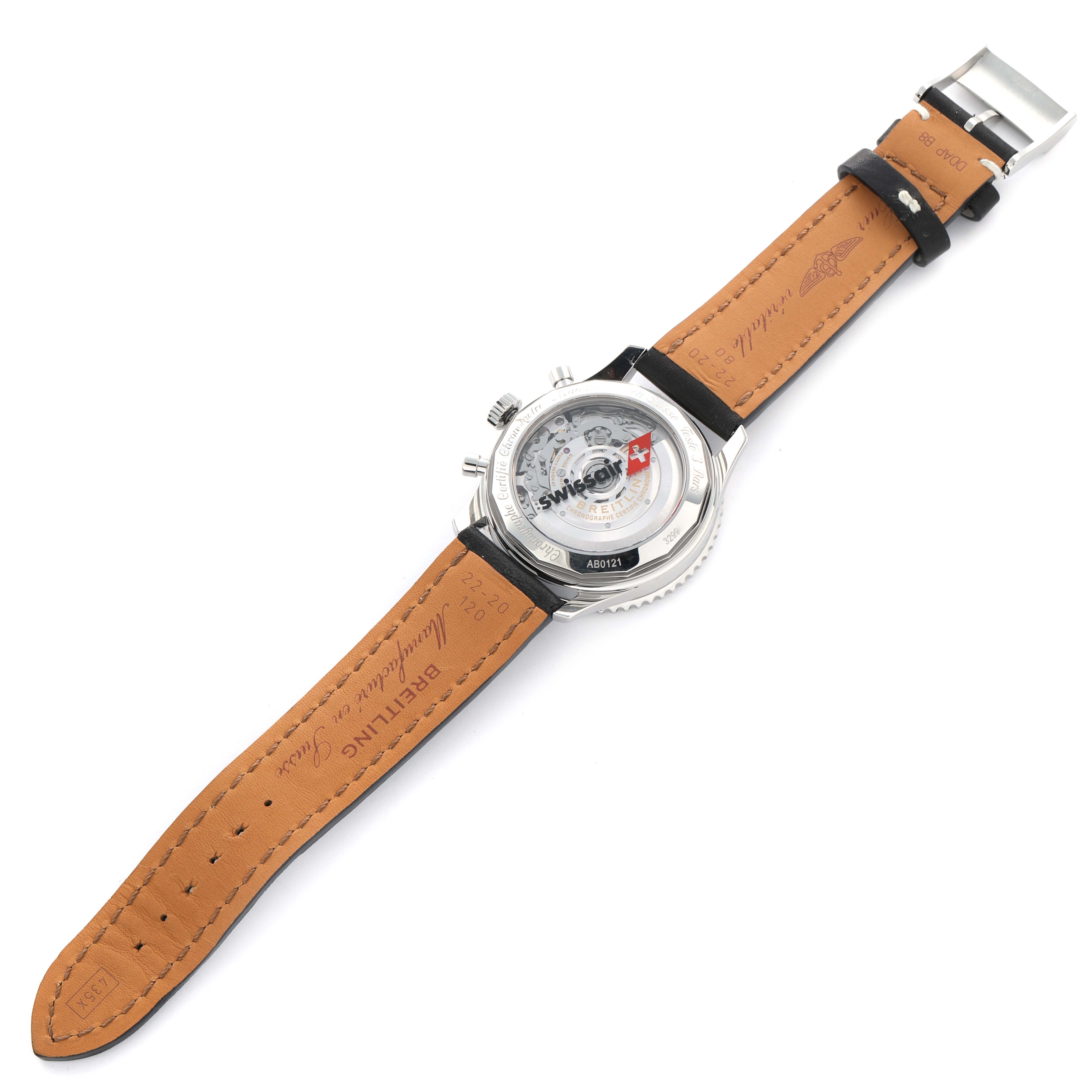 The image shows the back view of a Breitling Navitimer AB0121 Men
s Stainless Steel Black Dial watch, including the leather strap and transparent case back.