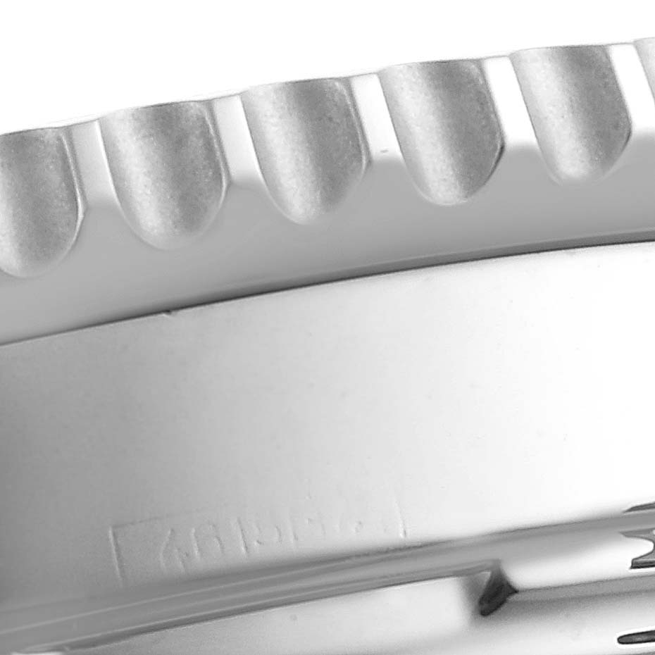 This image shows a close-up side view of the bezel and case of a Breitling Navitimer AB0121 Men's Stainless Steel Grey Dial AB0121 Men's Stainless Steel Grey Dial watch.