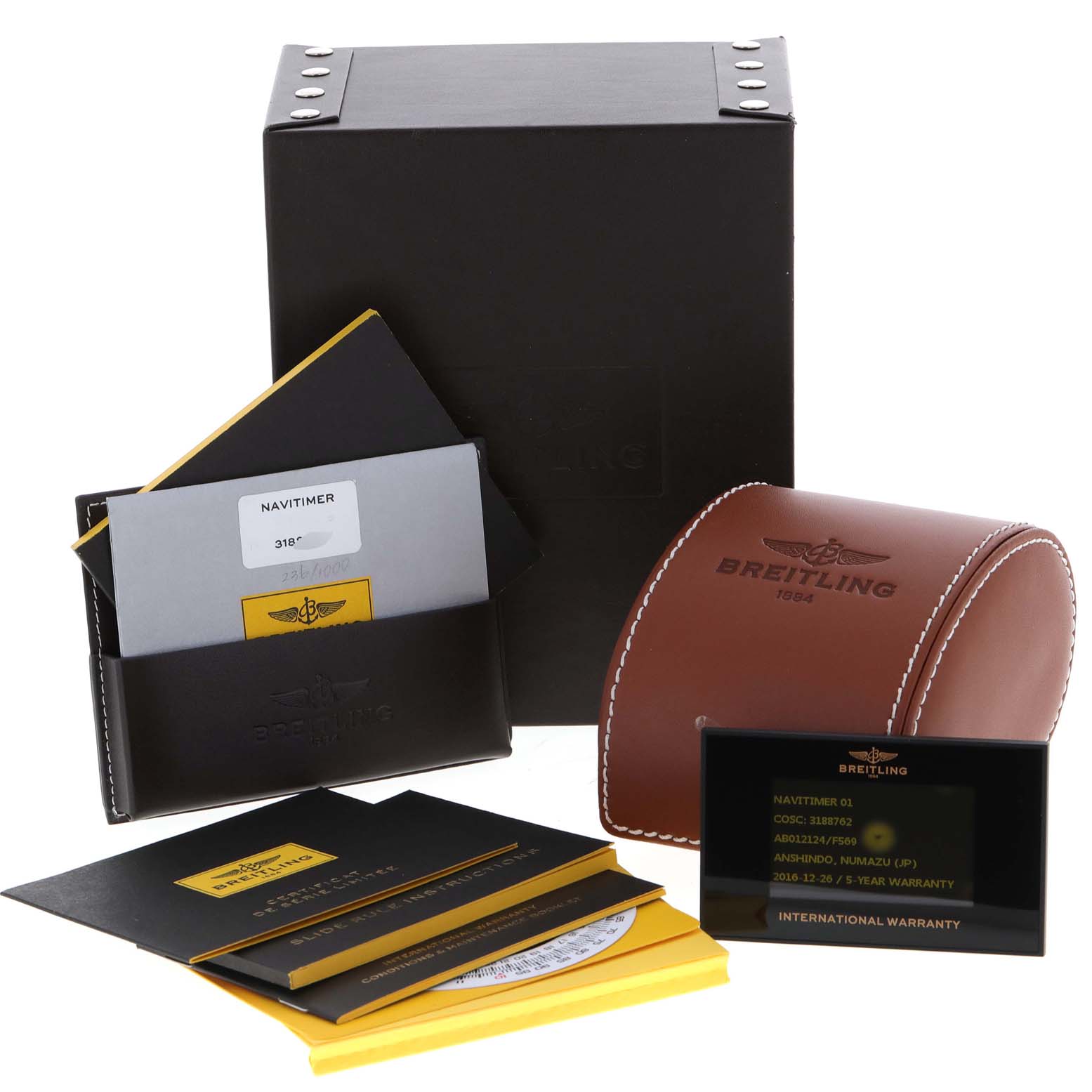 This image displays the packaging and accessories for a Breitling Navitimer AB0121 Men's Stainless Steel Grey Dial AB0121 Men's Stainless Steel Grey Dial watch, including boxes, warranty cards, and booklets.