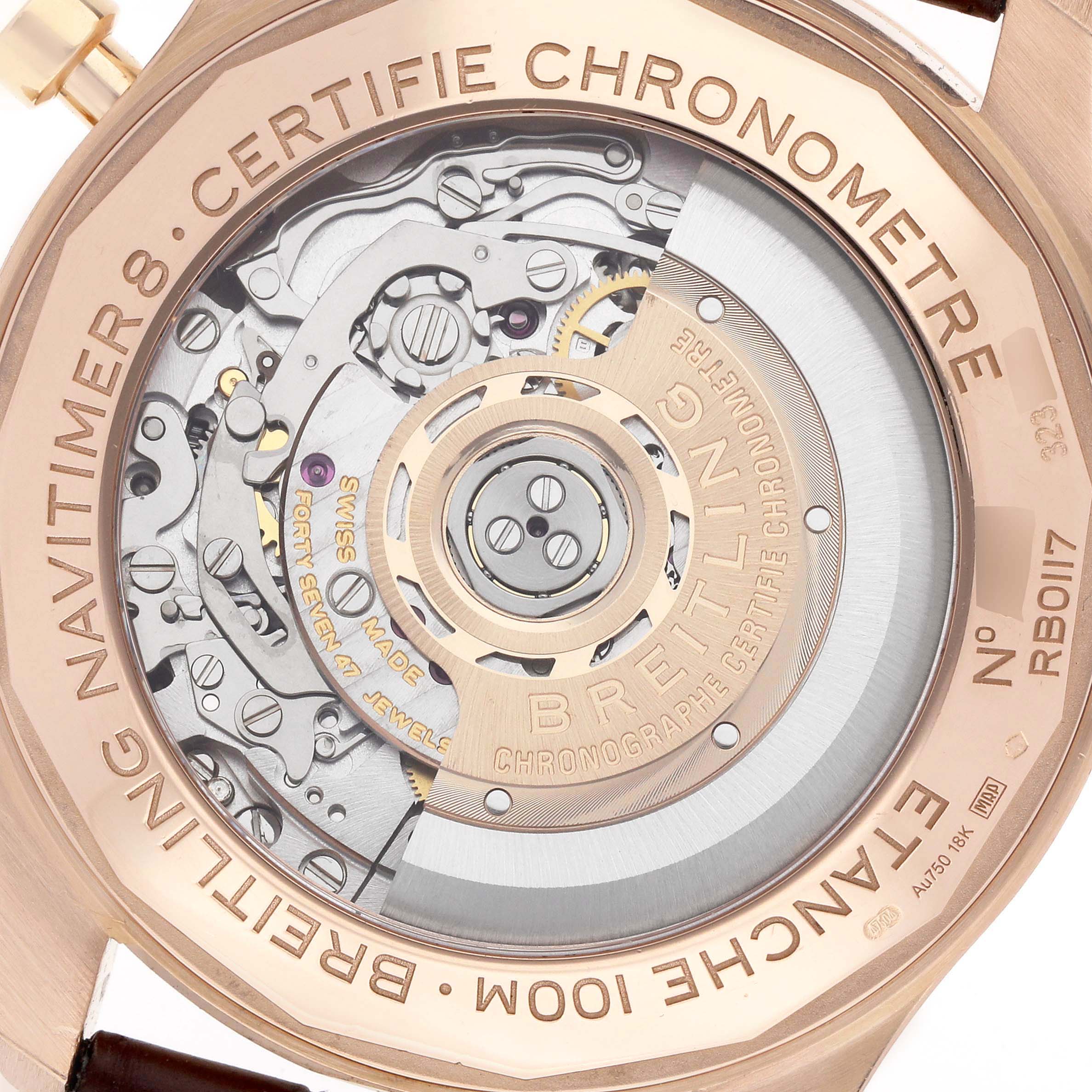 The image shows the back view of a Breitling Navitimer RB0117 Men
s Rose Gold Brown Dial, highlighting the intricate watch movement and engraving details.