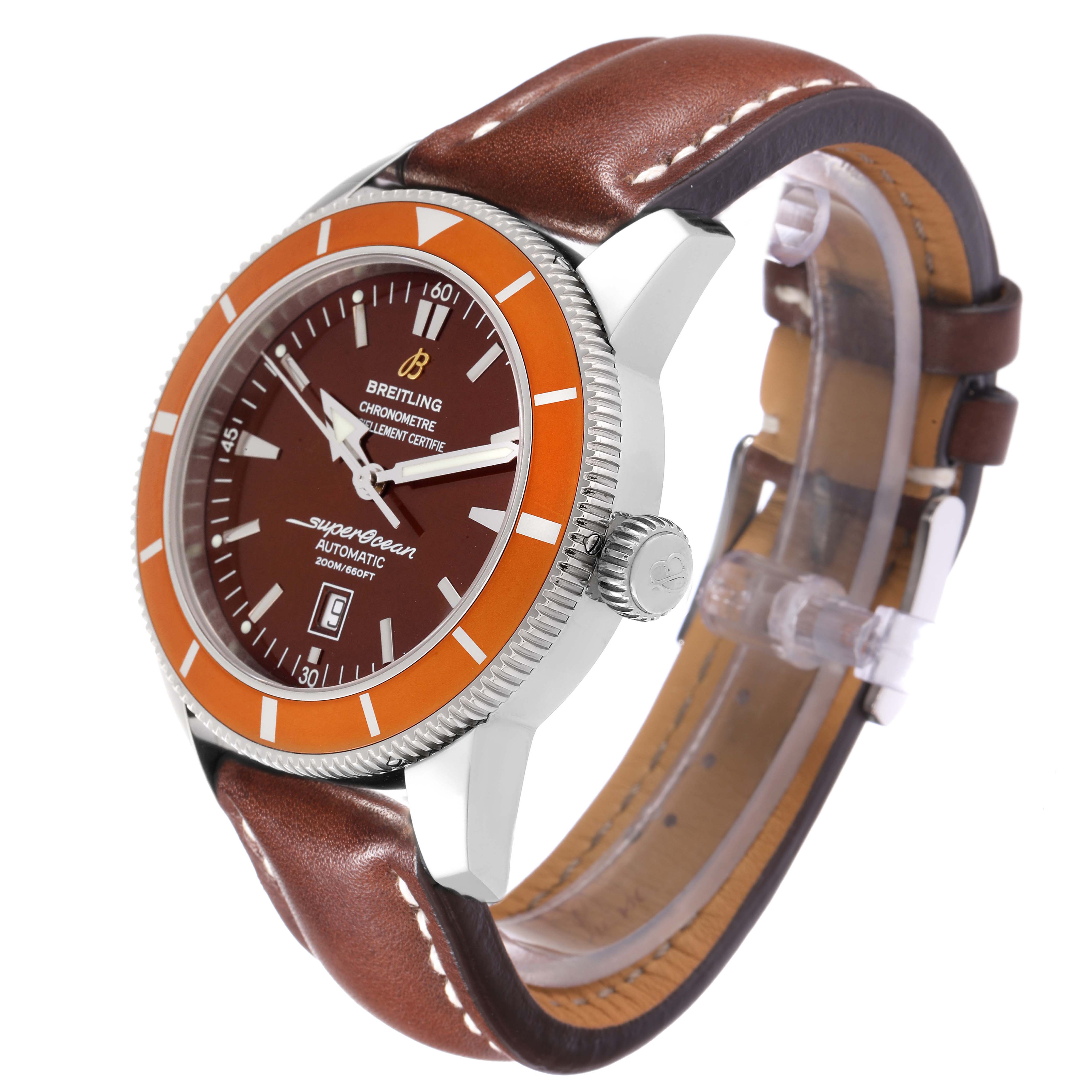 The Breitling Superocean A17320 Men
s Stainless Steel Brown Dial watch is shown from a side angle, displaying its orange bezel, brown leather strap, crown, and face details.