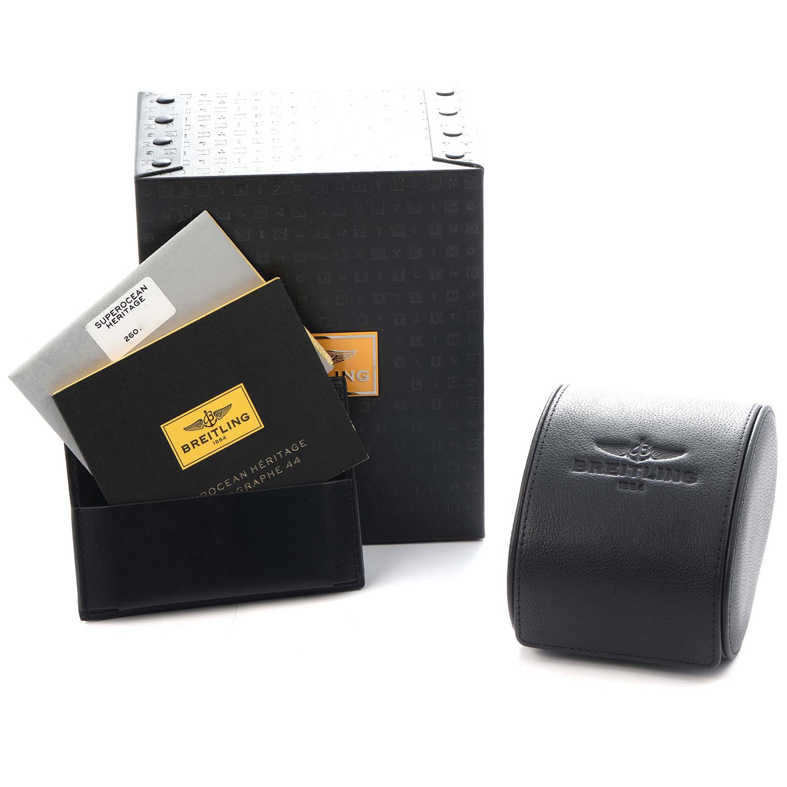 The image shows Breitling Superocean A17320 Men
s Stainless Steel Brown Dial watch packaging, including a box, pouch, and manuals, from a slightly angled view.