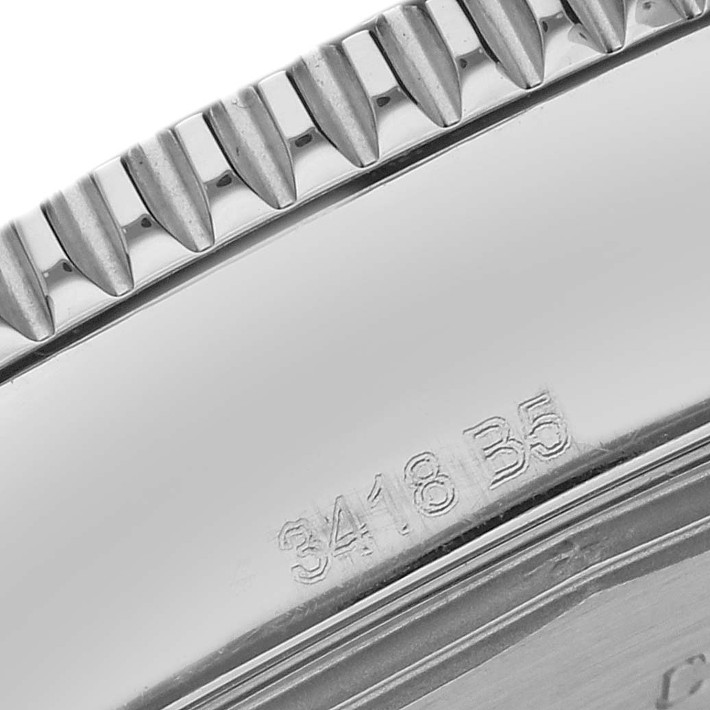 The image shows a close-up of the bezel on a Breitling Superocean A17365 Men
s Stainless Steel Blue Dial, highlighting the notched edge and engraved numbers.