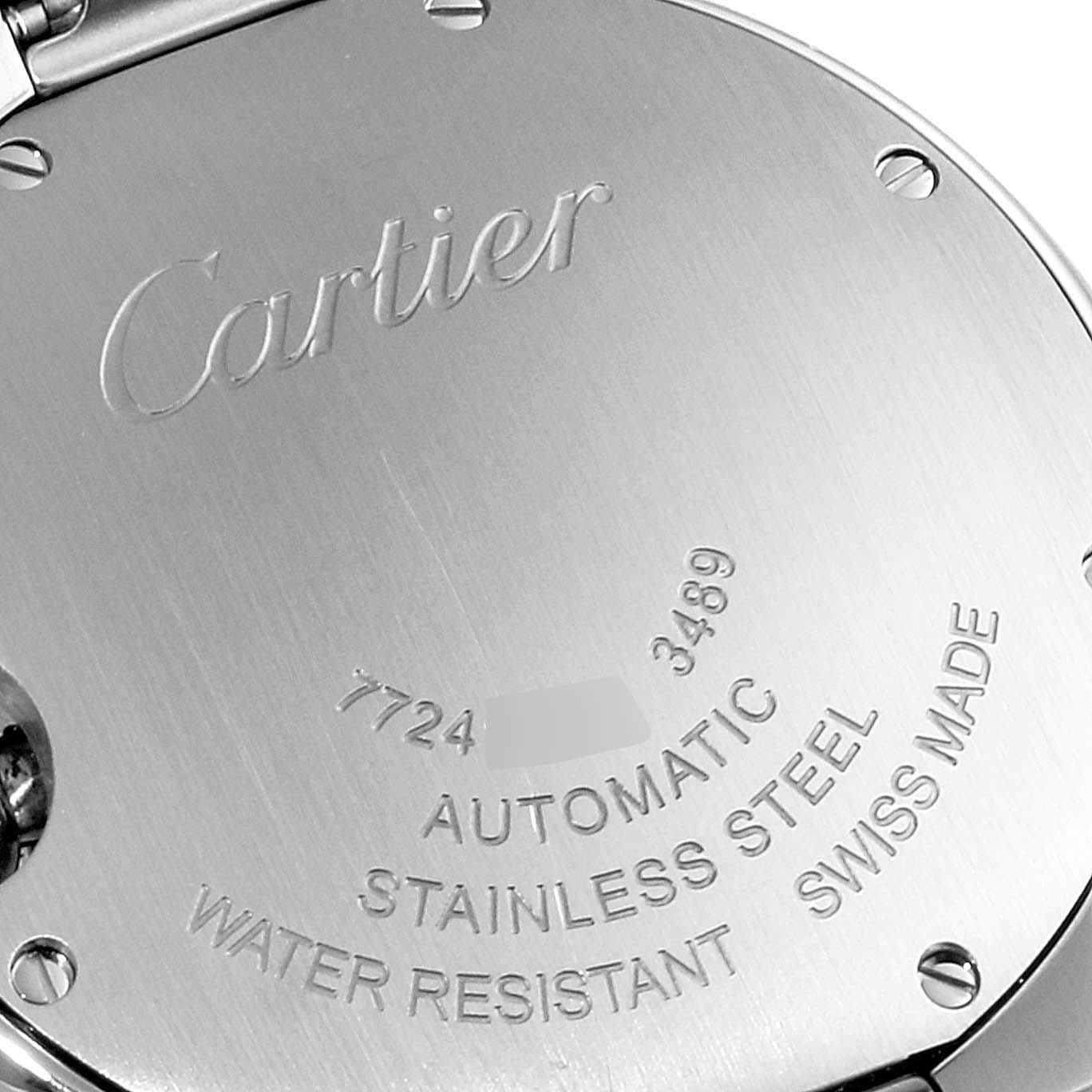 The image shows the case back of a Cartier Ballon Bleu WE902074 Women
s Stainless Steel Silver Dial WE902074 Women
s Stainless Steel Silver Dial watch, highlighting its engravings and stainless steel material.