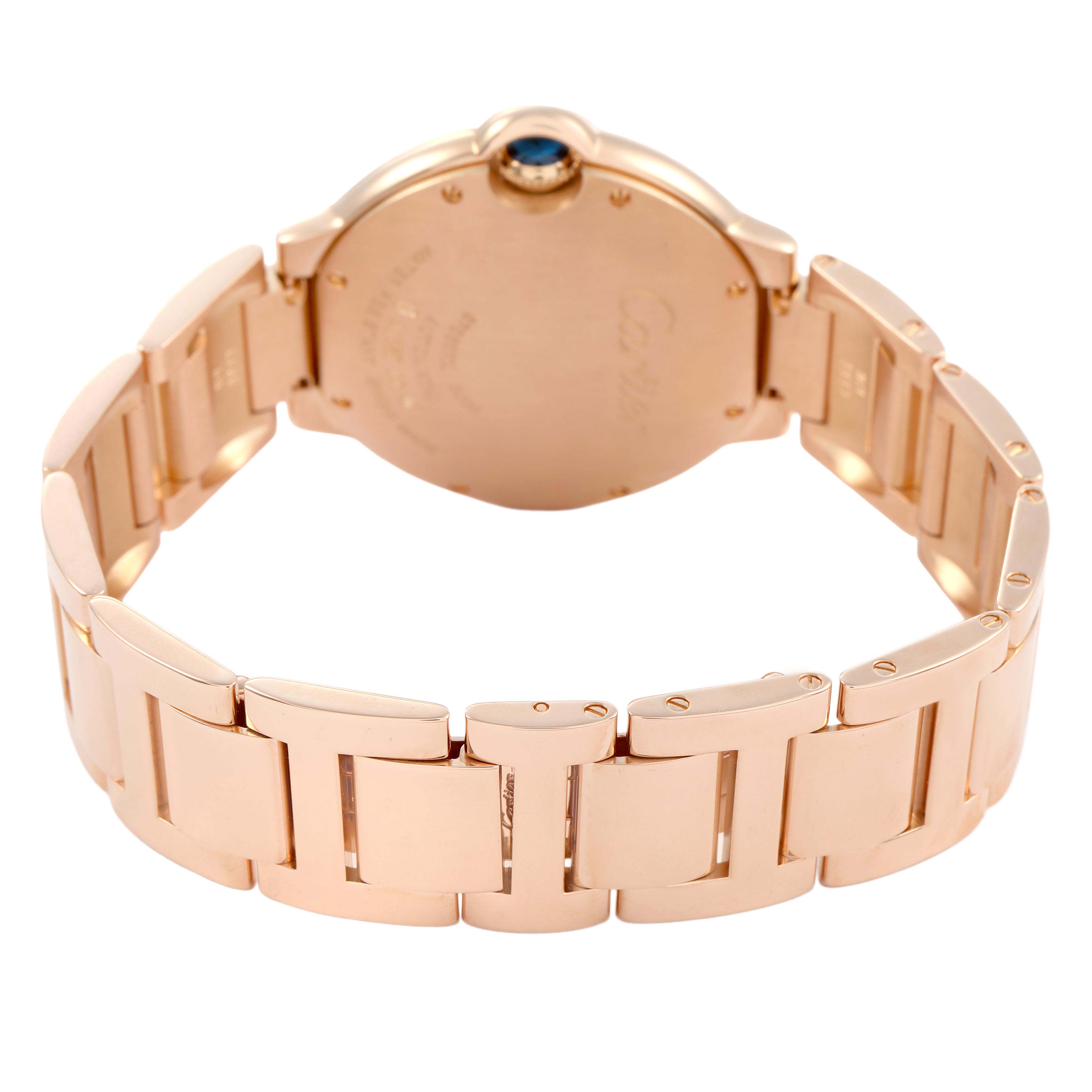 The image shows a Cartier Ballon Bleu W69004Z2 Men's Rose Gold Silver Dial watch from the rear, highlighting the bracelet and case back.