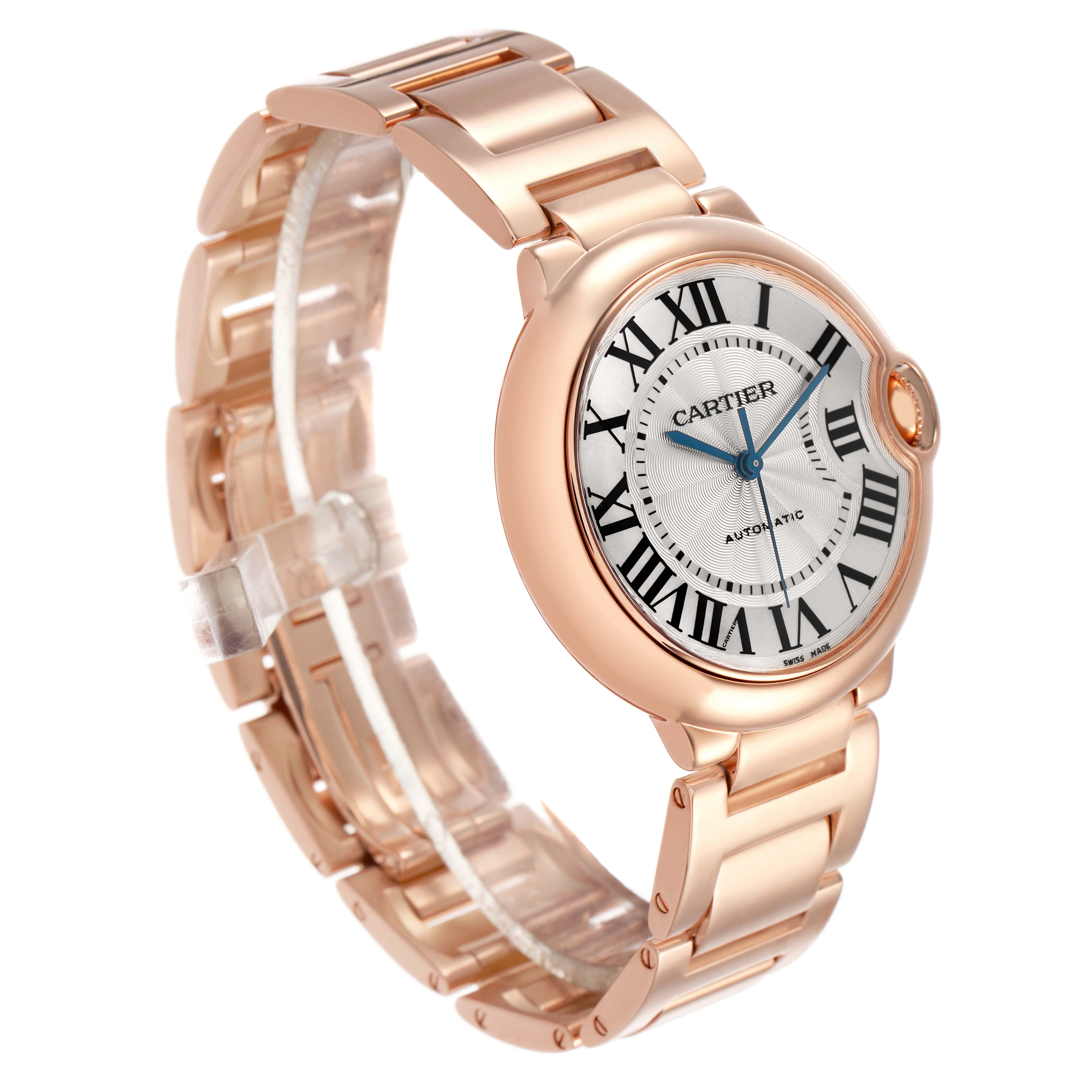 The Cartier Ballon Bleu W69004Z2 Men's Rose Gold Silver Dial watch is shown at a three-quarter angle, featuring the face, Roman numerals, bracelet, and crown.