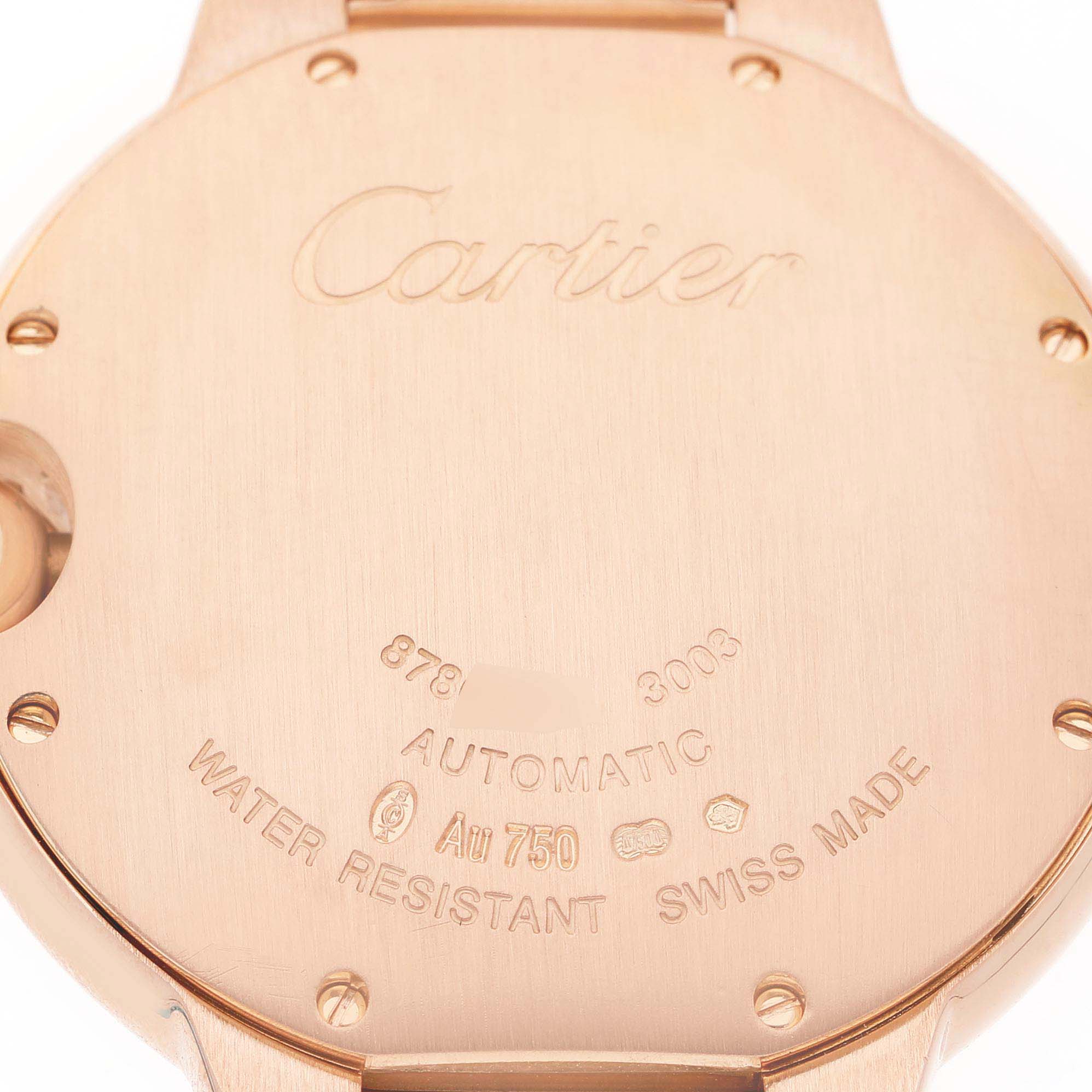 The image shows the back case of the Cartier Ballon Bleu W69004Z2 Men's Rose Gold Silver Dial watch, engraved with details like "Automatic" and "Water Resistant."