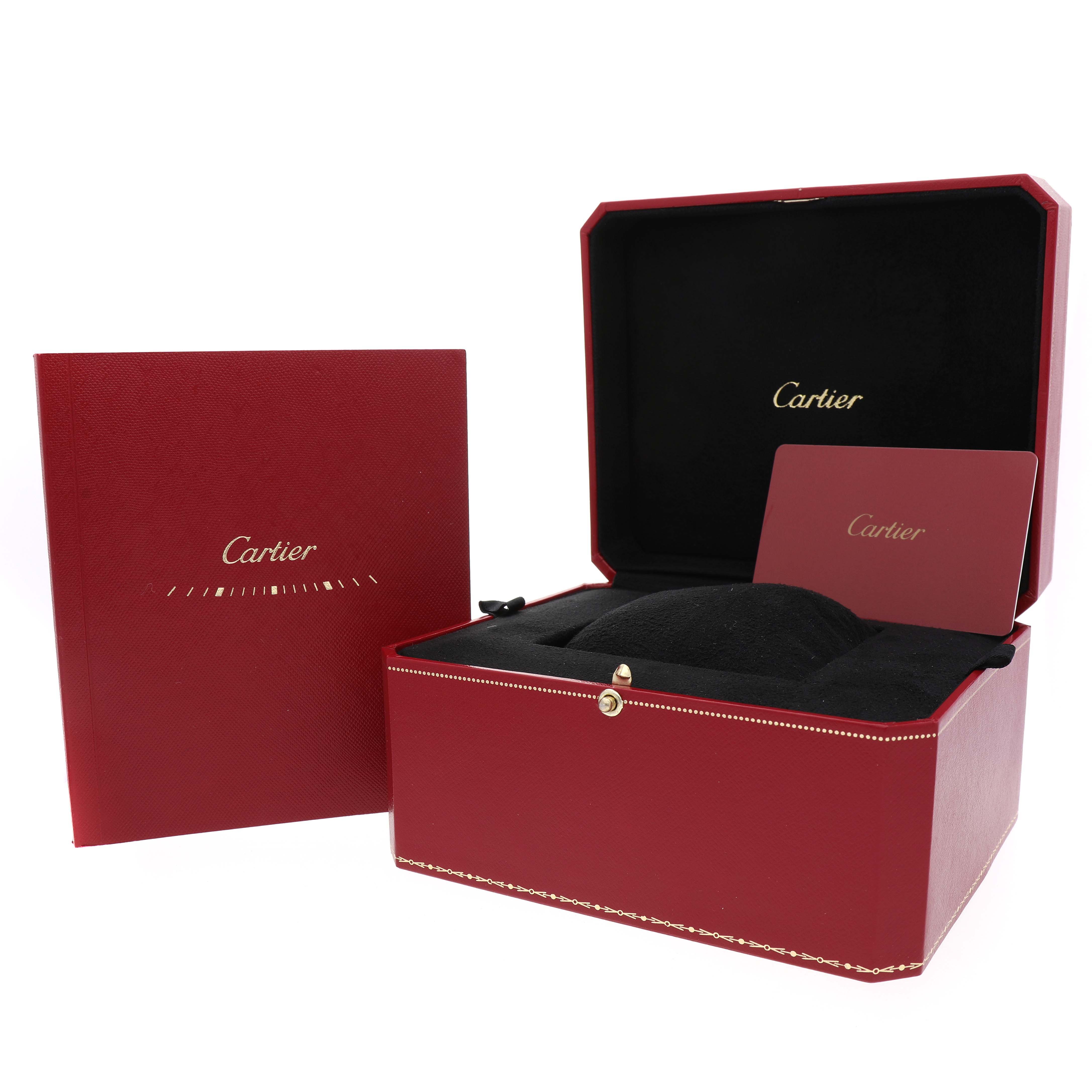 The image shows the packaging and accessories for the Cartier Ballon Bleu W4BB0017 Men's Stainless Steel Silver Dial, including a red box with a booklet and card.