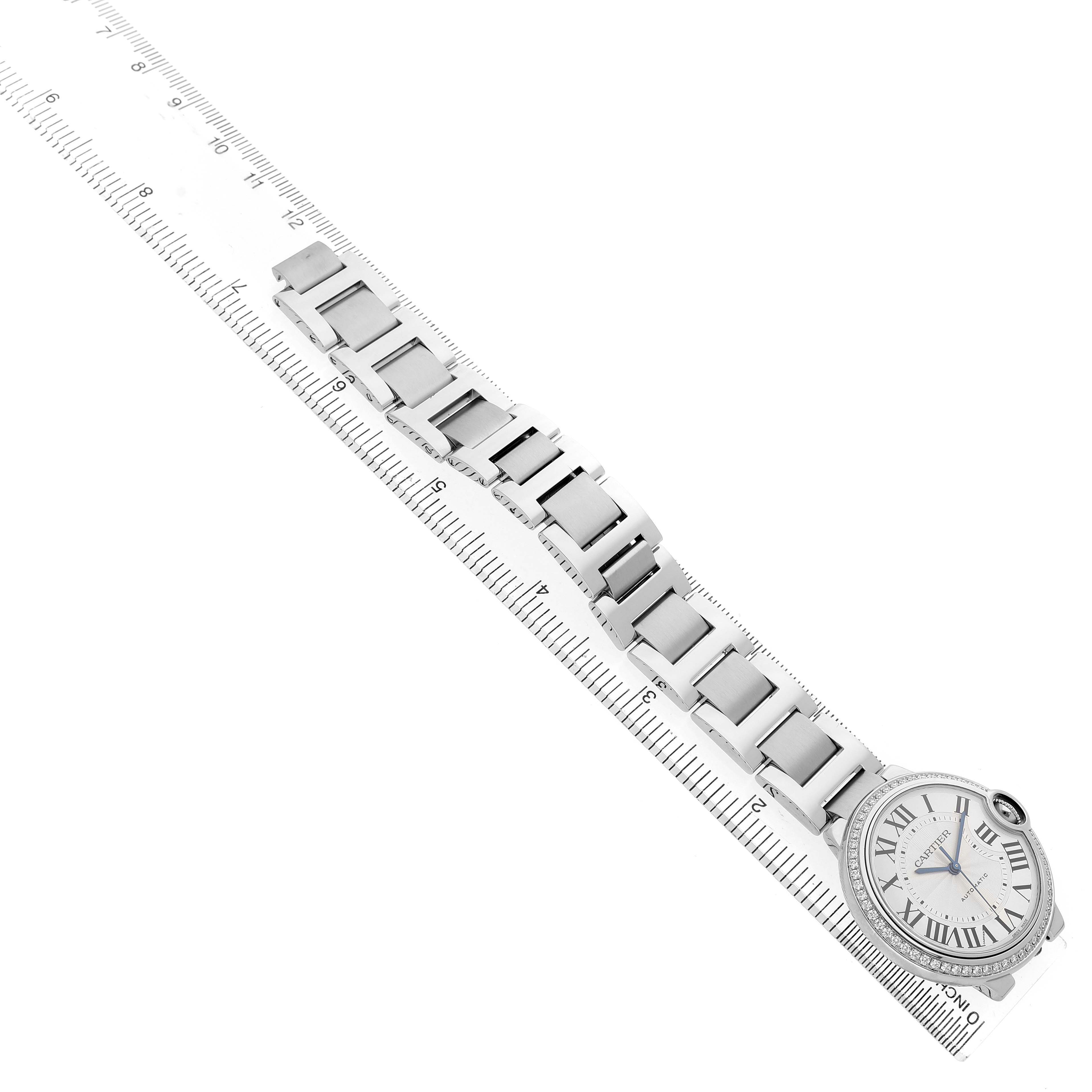 The Cartier Ballon Bleu W4BB0017 Men's Stainless Steel Silver Dial watch is shown from a top angle, displaying the face, bracelet, and part of the crown.