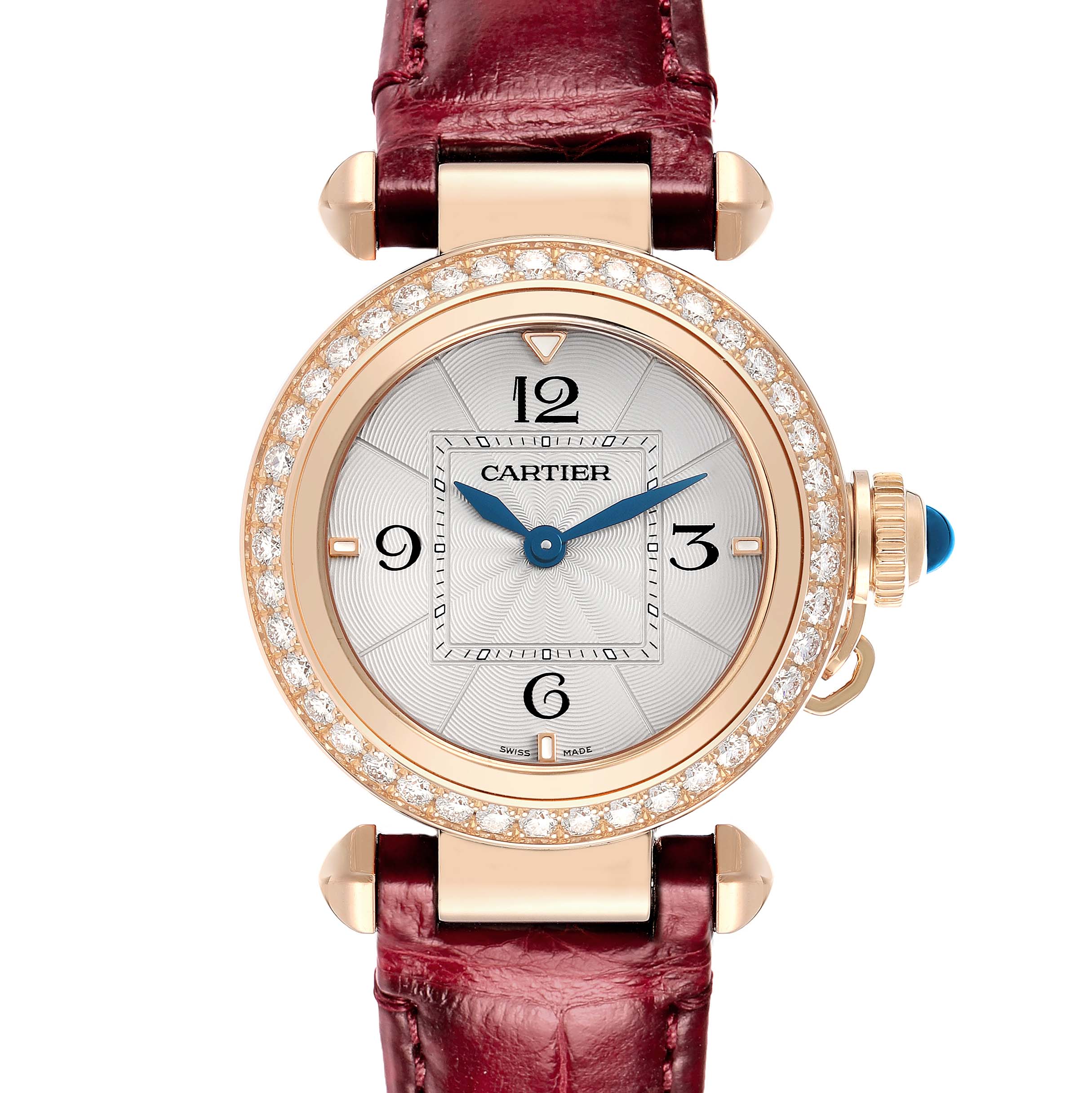 The Cartier Pasha WJPA Women's Rose Gold Silver Dial watch is shown from a top-down angle, displaying the dial, diamond bezel, blue crown, and red strap.