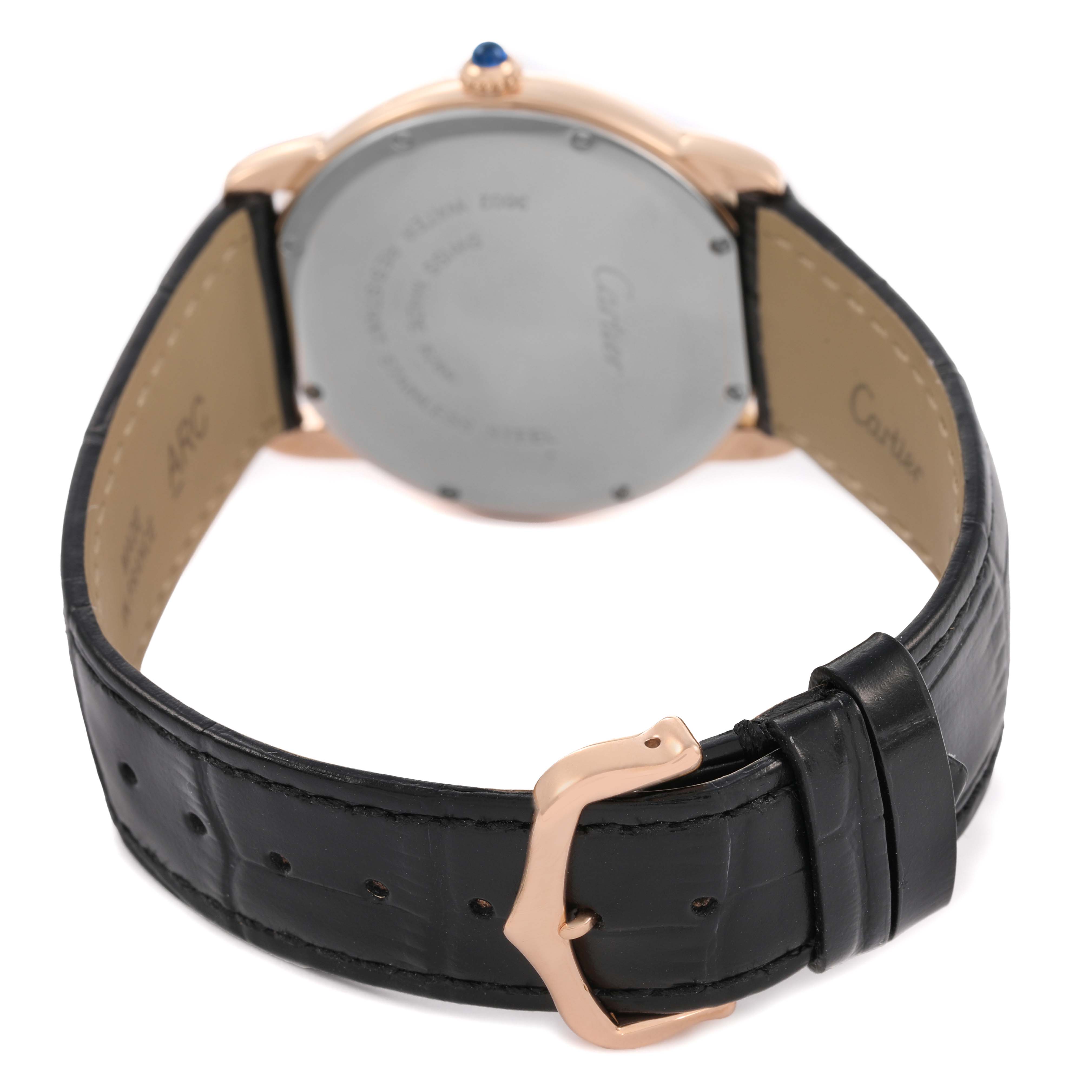 The Cartier Ronde W6701008 Men's Rose Gold Silver Dial watch is shown from the back, highlighting the case back, crown, and black leather strap with a gold clasp.